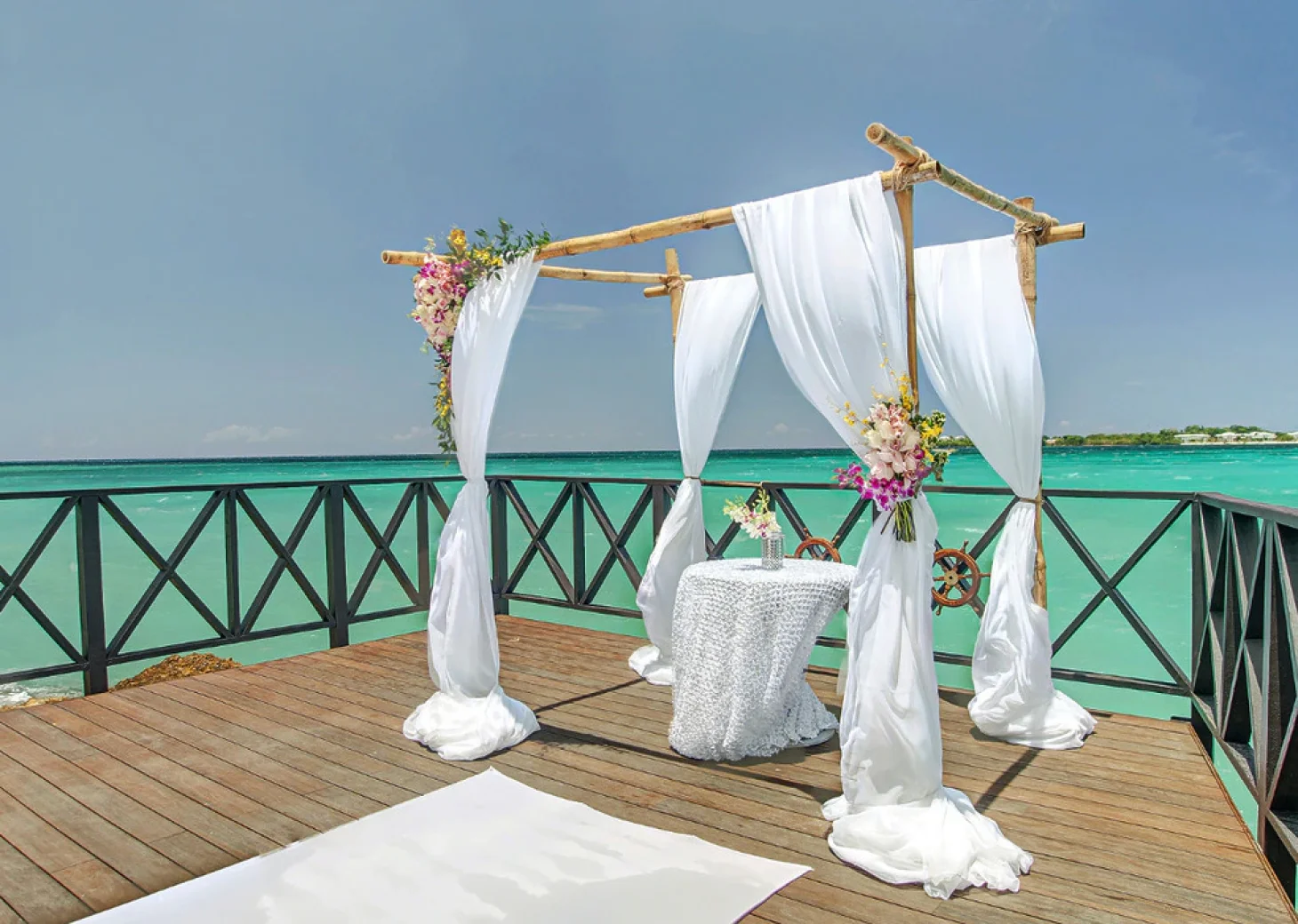 Ceremony decor in the charmin ocean pier at Hideaway at Royalton Negril