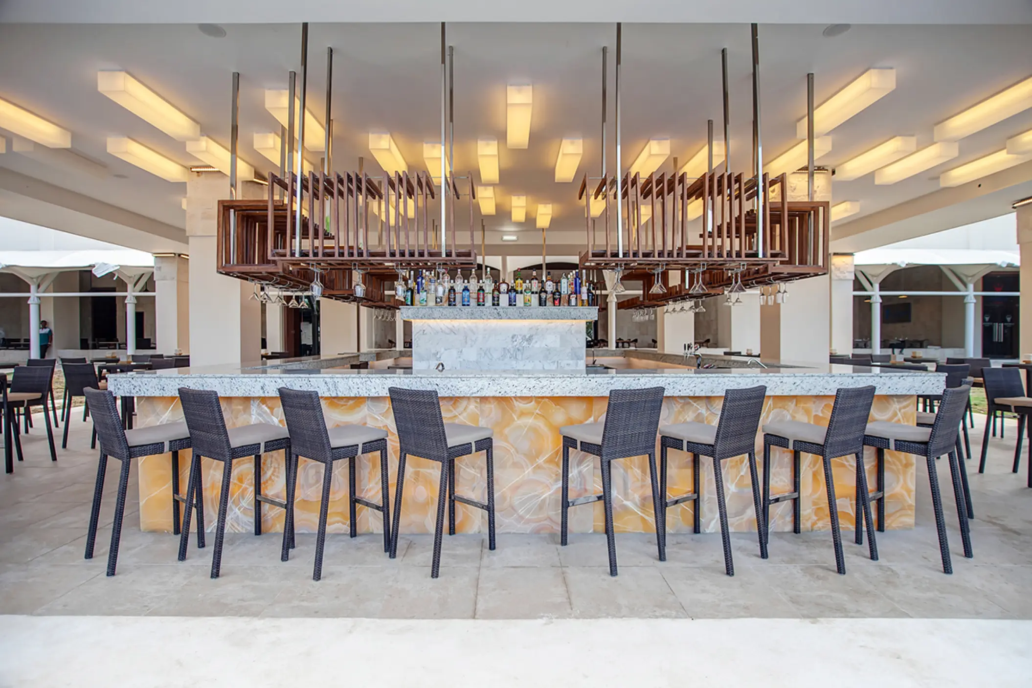 Martini Mix bar with modern lighting and stool seating at Royalton Hideaway Negril