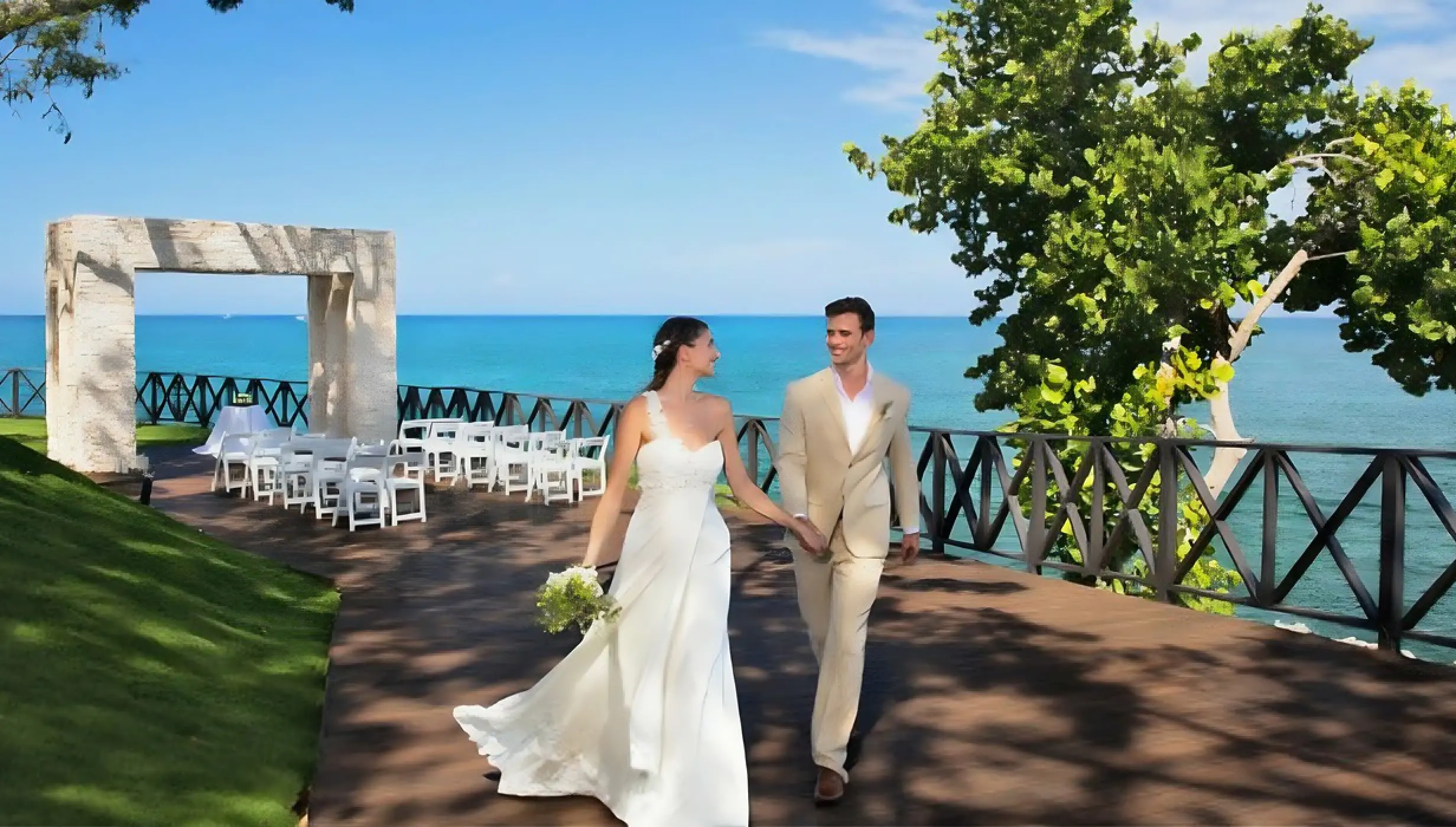 The bride and groom walking on Ocean Point terrace after their wedding ceremony at Royalton Hideaway Negril