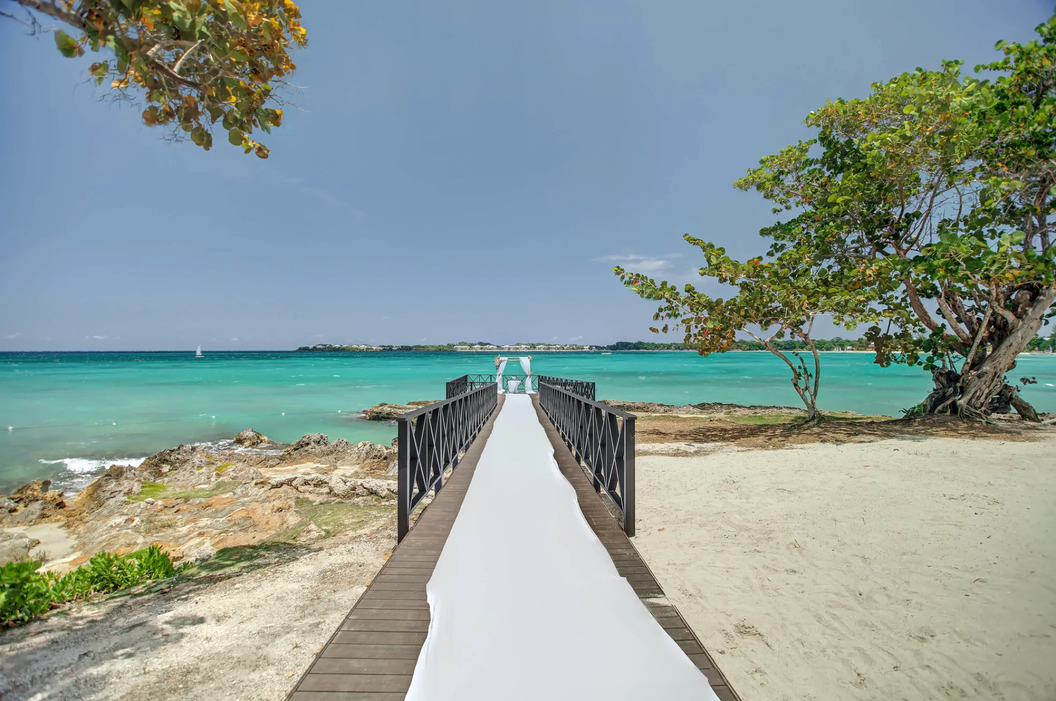 Pier wedding ceremony venue over turquoise water at Royalton Hideaway Negril, Negril