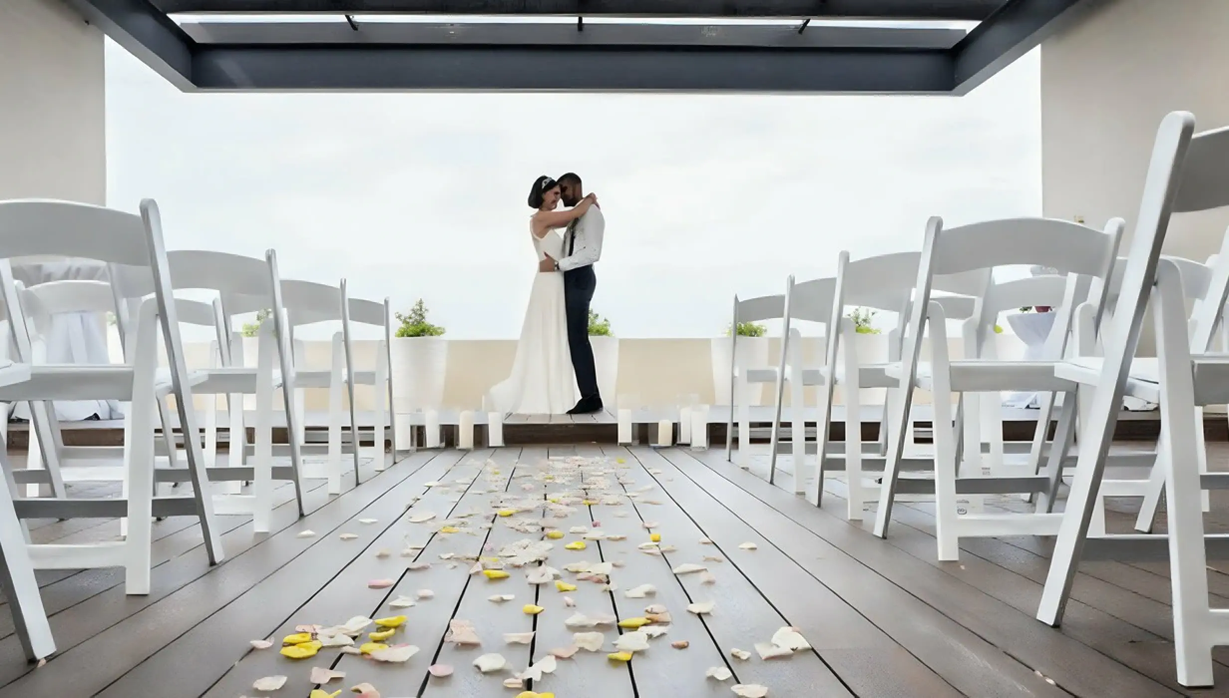 The bride and groom embracing on the sky terrace at Royalton Hideaway Negril, Jamaica
