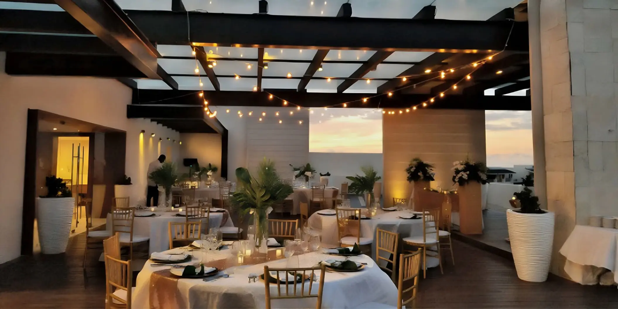 Sky terrace wedding reception with string lights at Royalton Hideaway Negril