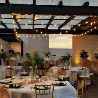 Sky terrace wedding reception with string lights at Royalton Hideaway Negril