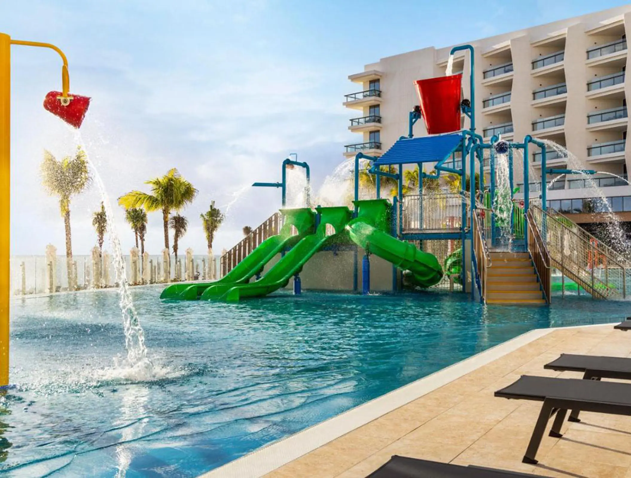 Children's water park and pool with green slides at Hilton Cancun, Cancun