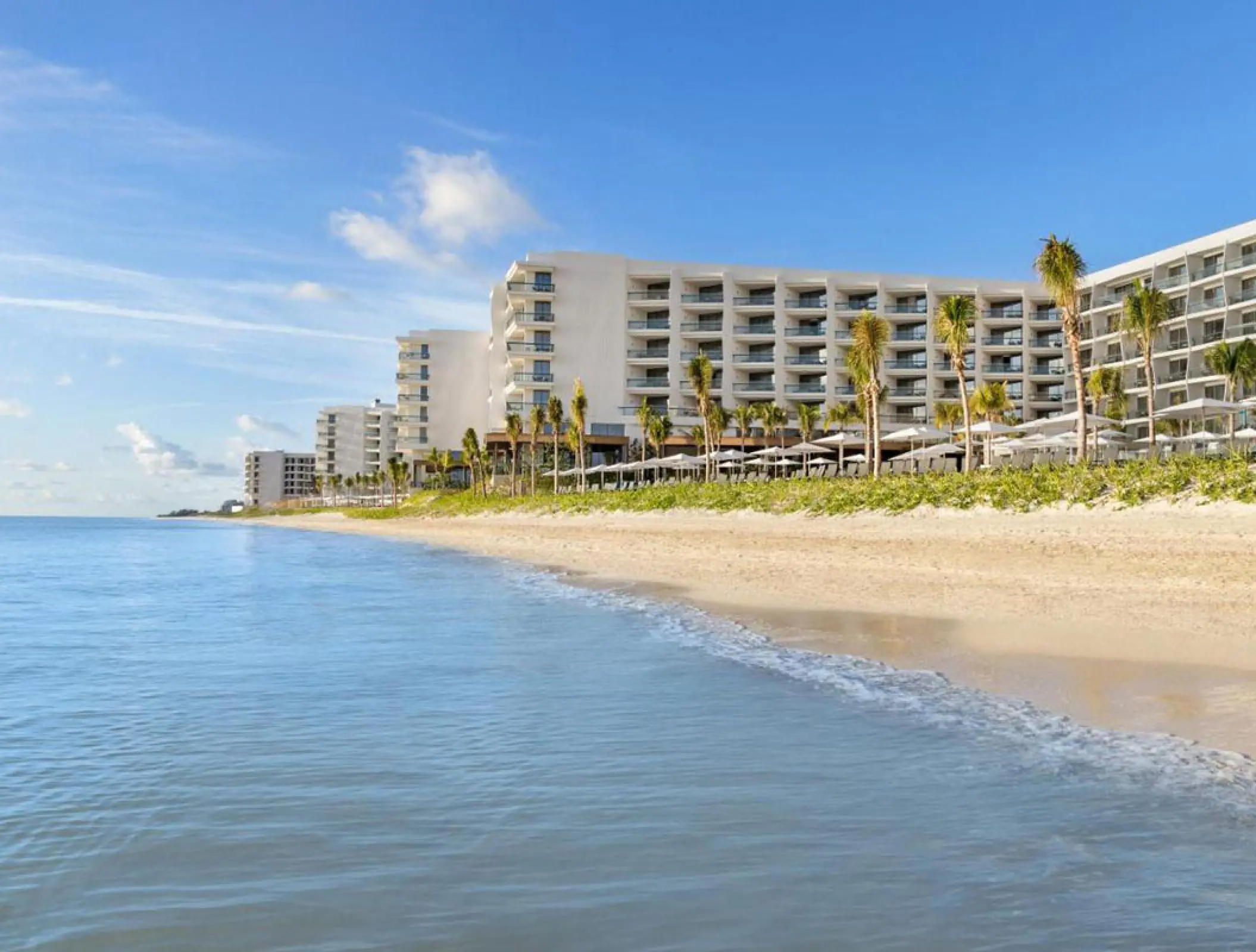 Hilton Cancun exterior and beachfront viewed from the turquoise water, Cancun