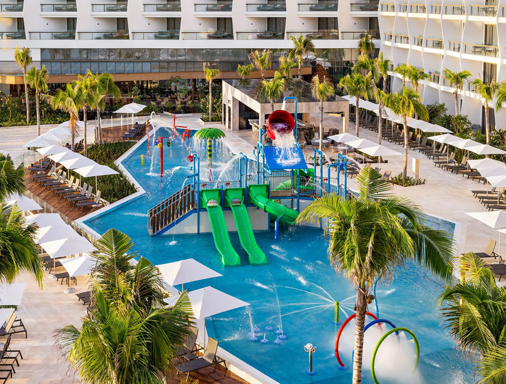 Kids water park and splash pool with slides at Hilton Cancun