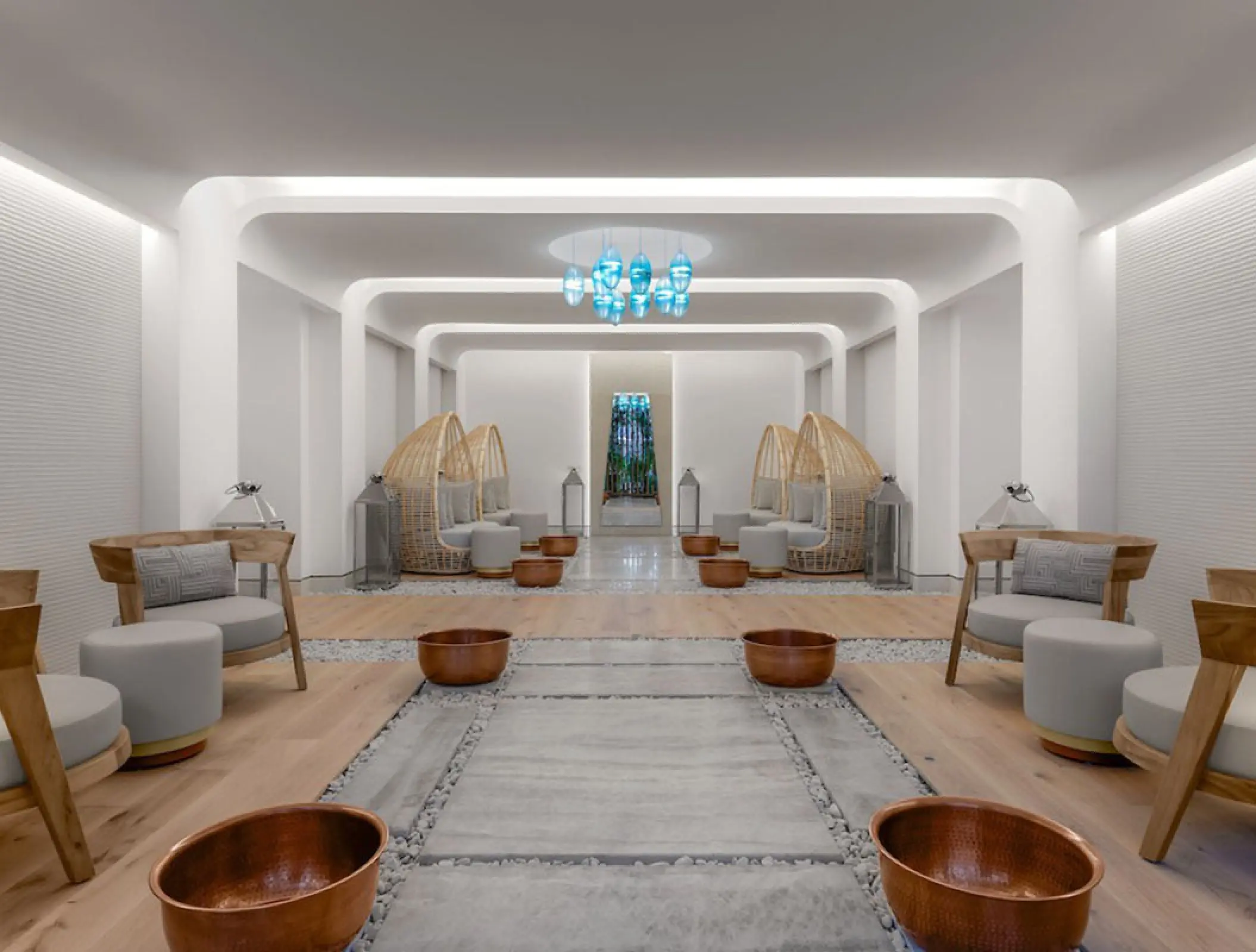 Modern spa lounge with pedicure stations and woven chairs at Hilton Cancun, Cancun