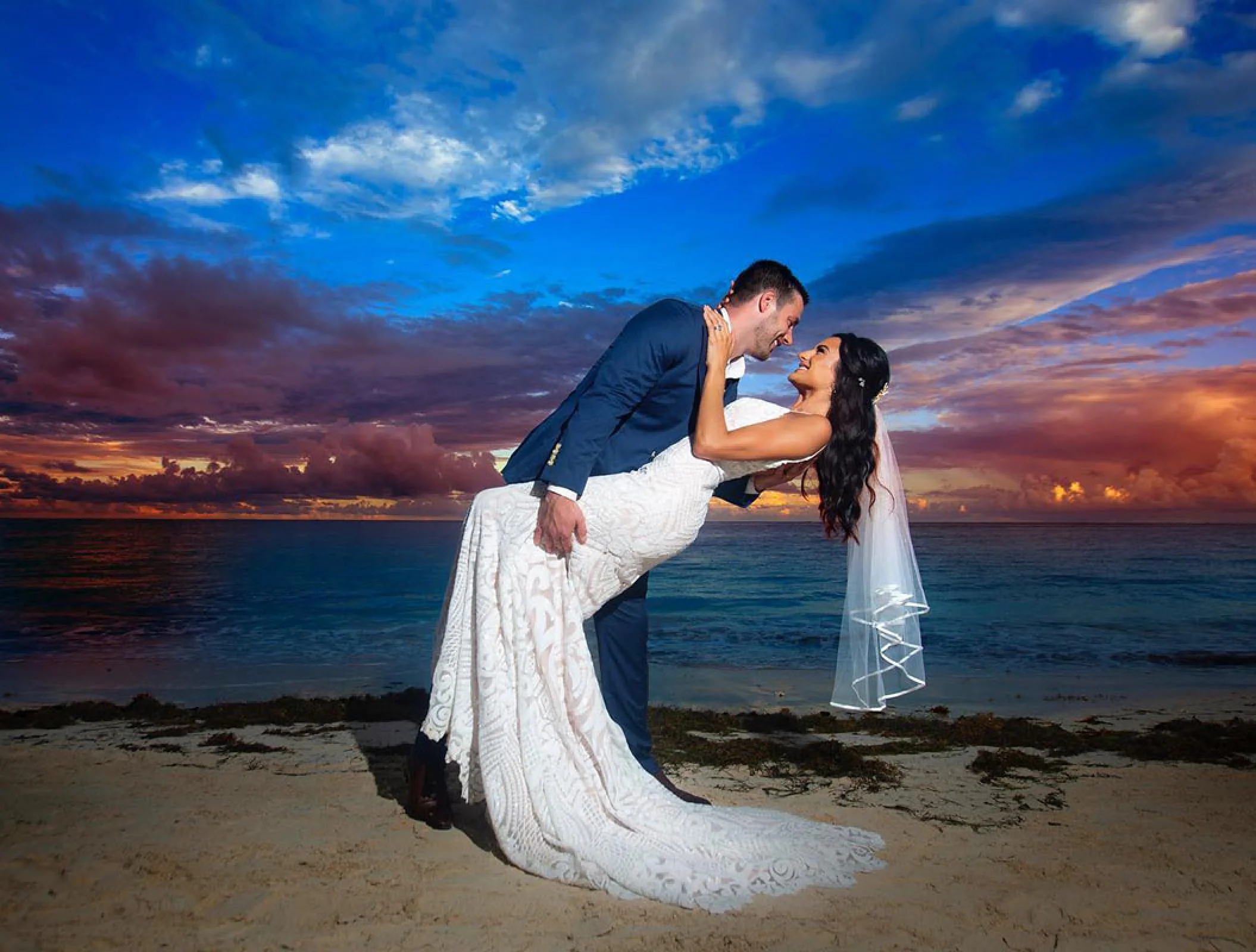 Just married Couple at the beach in Hilton Cancun.