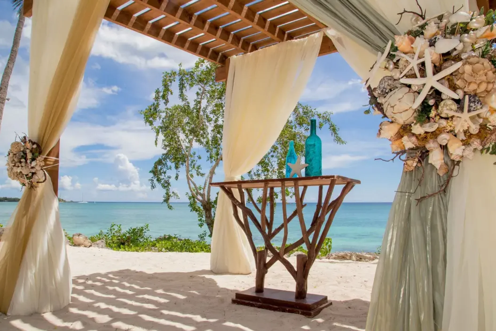 Ceremony decor at the beach gazebo at Secrets La Romana Resort & Spa