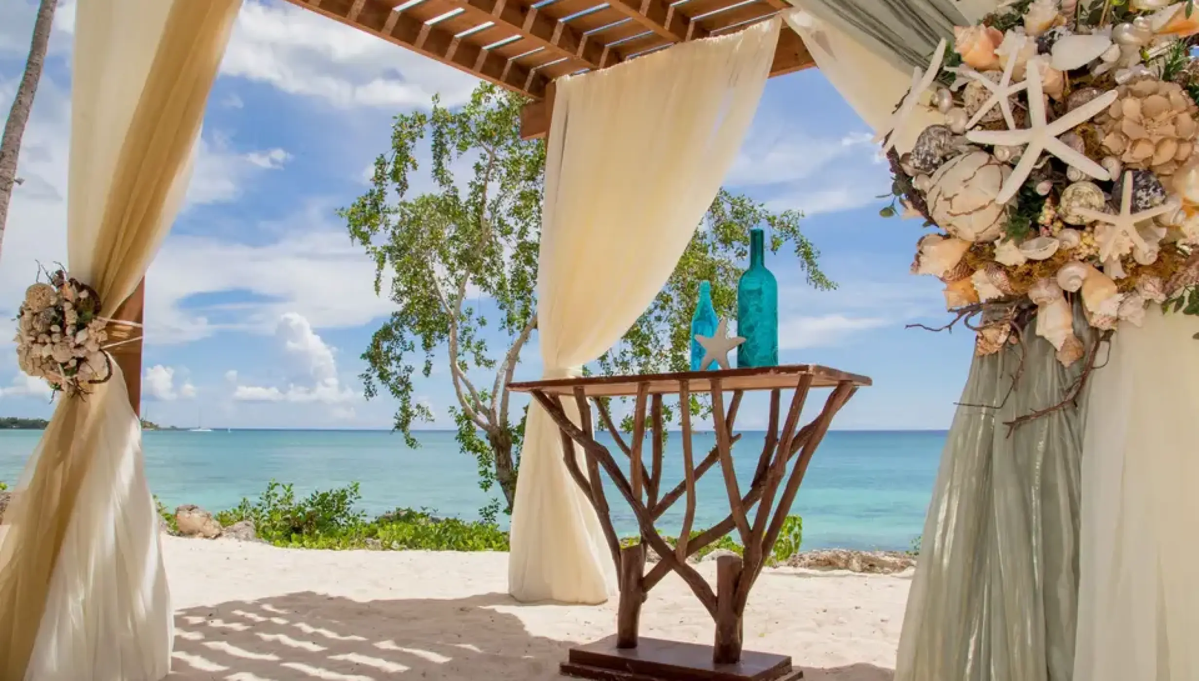 Ceremony decor at the beach gazebo at Secrets La Romana Resort & Spa