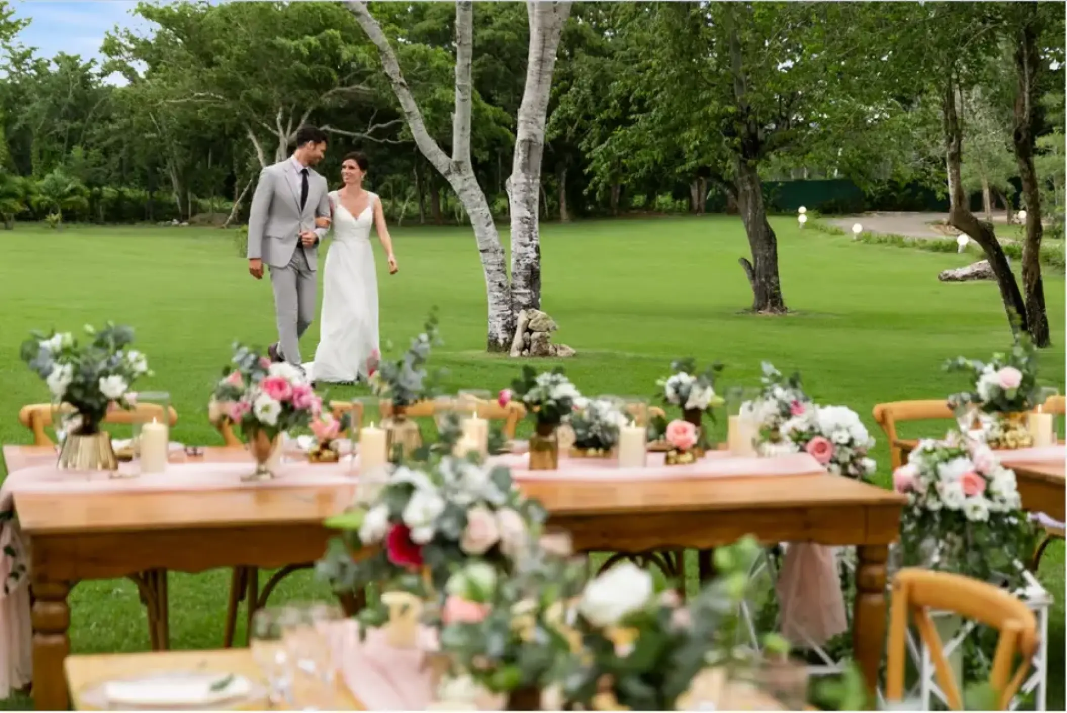 Bride and groom walking through the gardens at Secrets La Romana, La Romana
