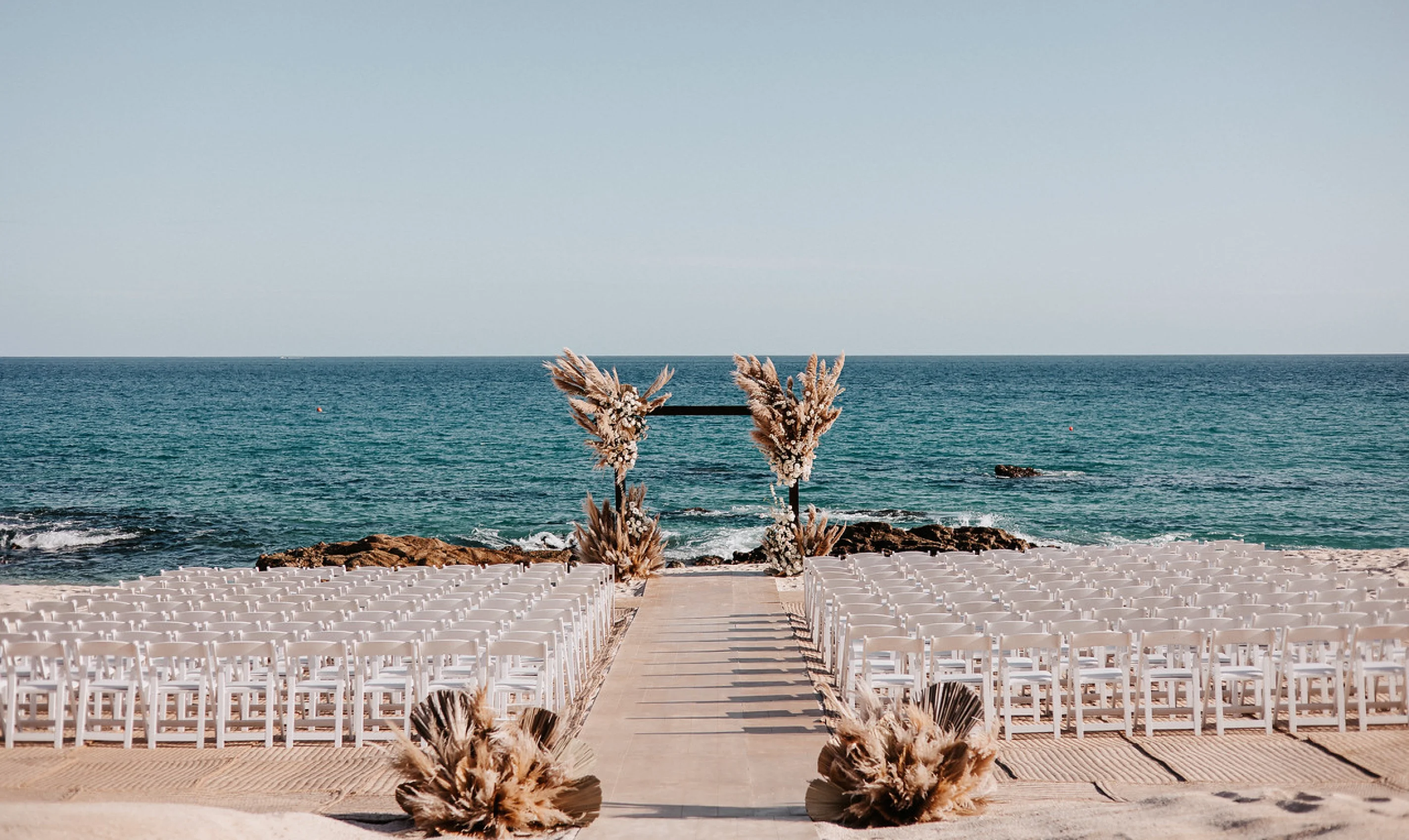 Ceremony decor on the beach at Hilton Los Cabos Beach and Golf