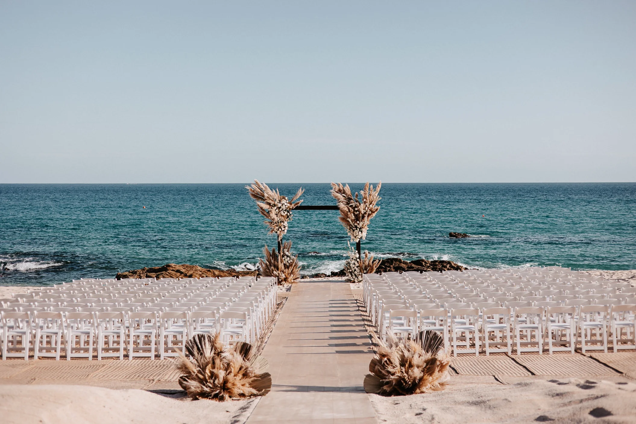 Ceremony decor on the beach at Hilton Los Cabos Beach and Golf