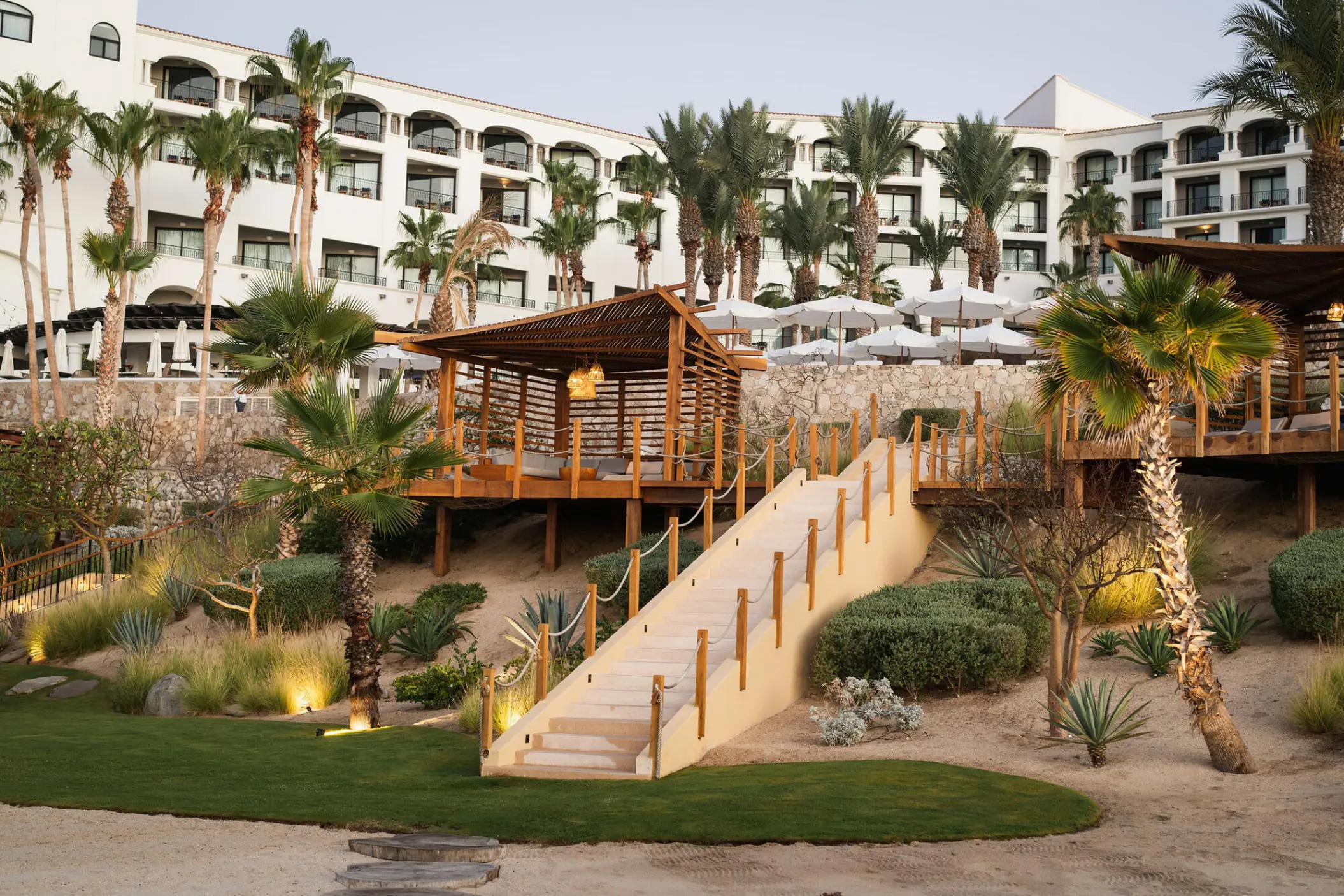 White exterior and wooden terrace at Hilton Los Cabos, Cabo San Lucas