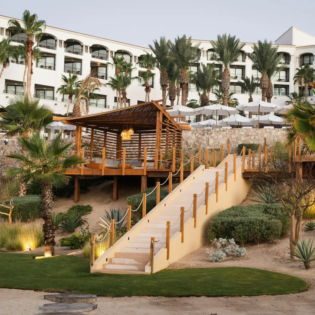 White exterior and wooden terrace at Hilton Los Cabos, Cabo San Lucas