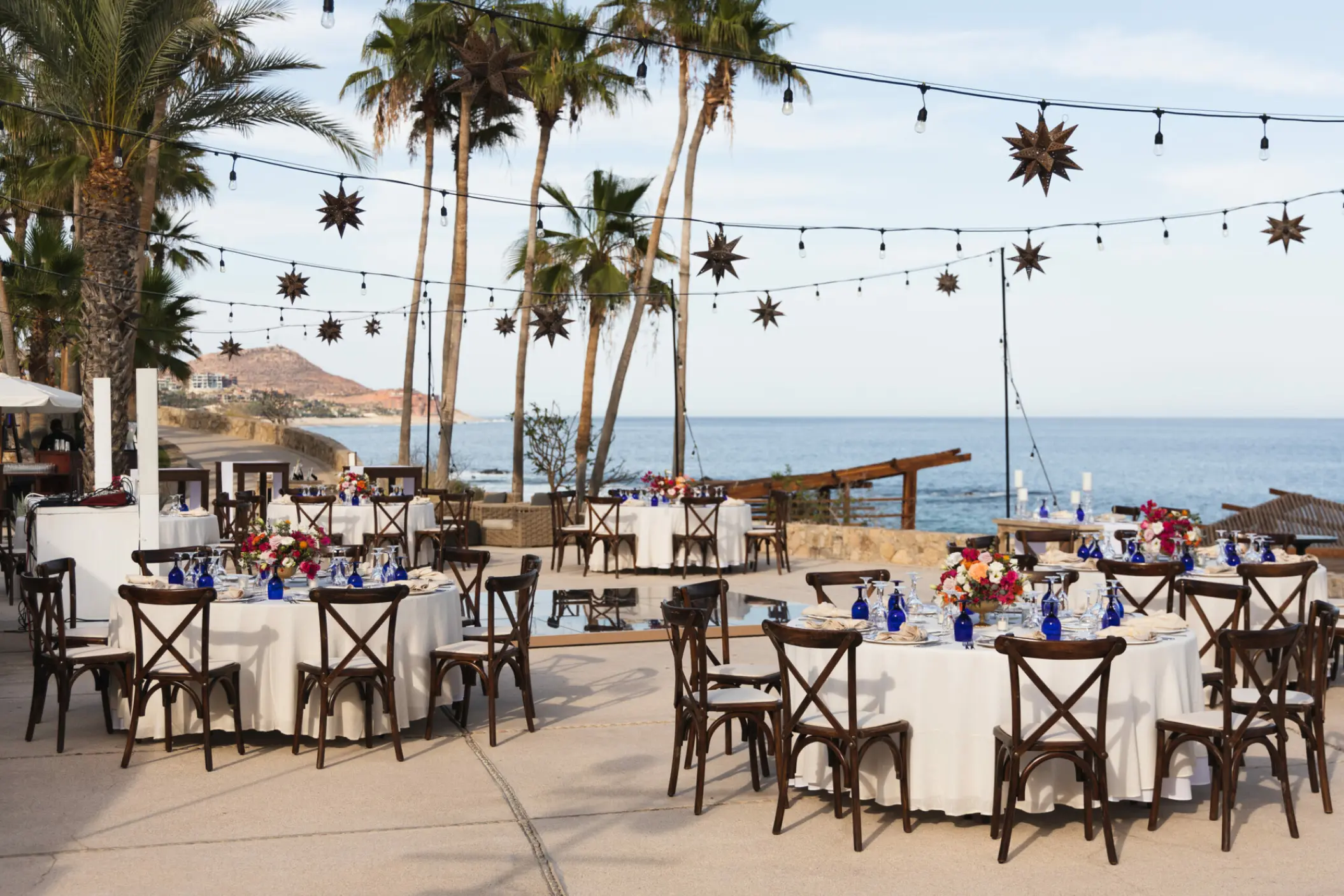 Outdoor wedding reception with star-shaped lanterns on the Whale Watching Terrace at Hilton Los Cabos, Cabo San Lucas