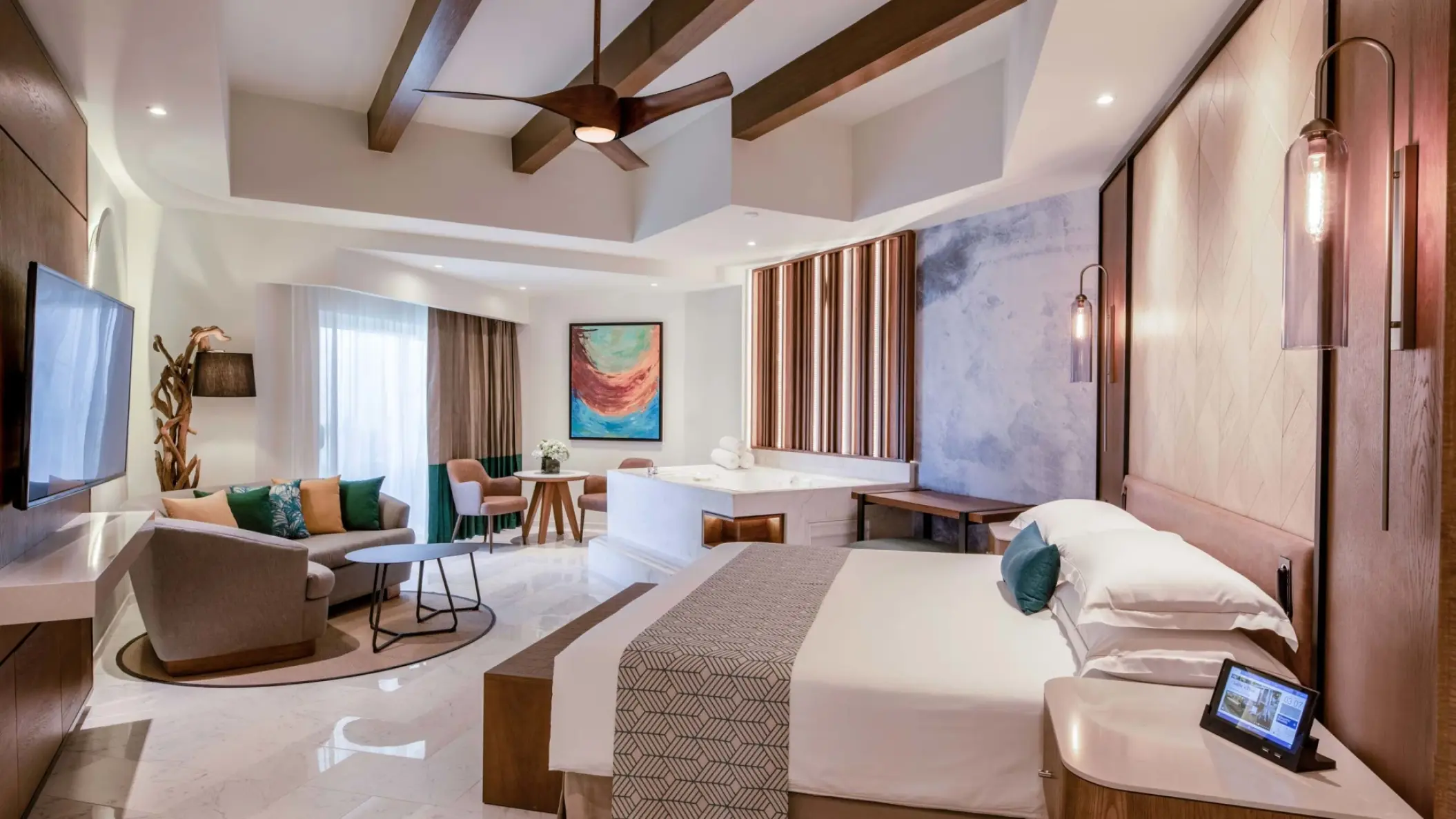 Junior Suite bedroom with seating area and indoor tub at Hyatt Vivid Playa del Carmen