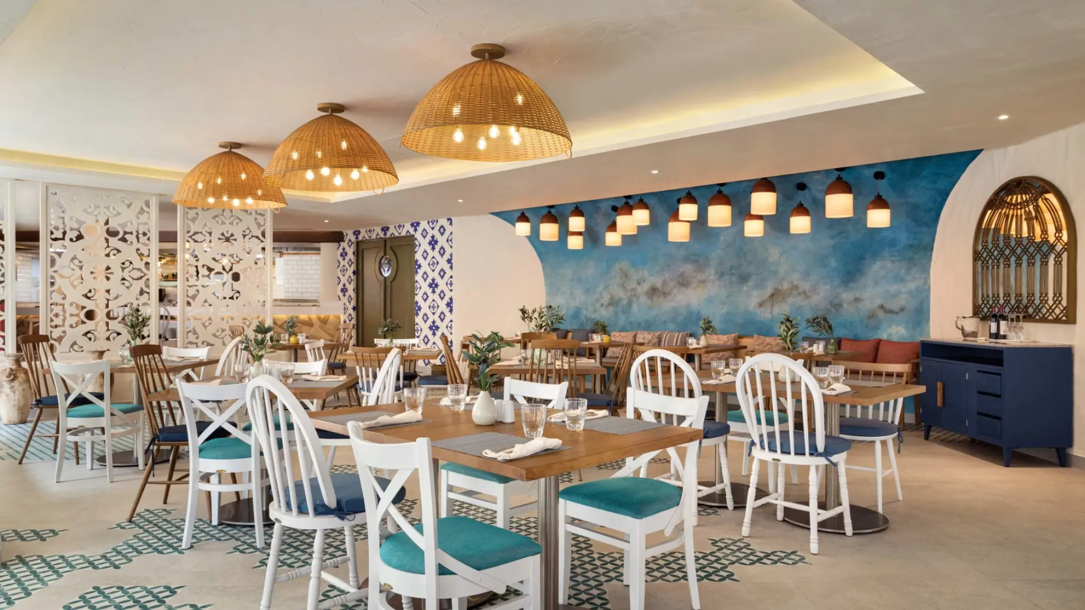 Kalamata restaurant dining area with blue accents at Hyatt Vivid Playa del Carmen