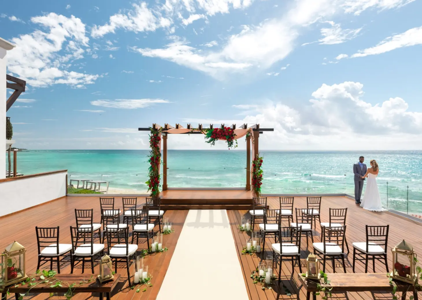 oceanfront wedding venue deck, chairs and altar at Hilton Playa del Carmen