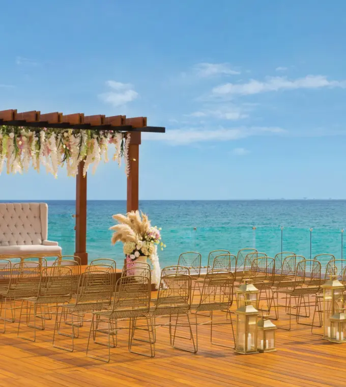 Oceanfront wedding ceremony setup on a terrace at Hilton Playa del Carmen