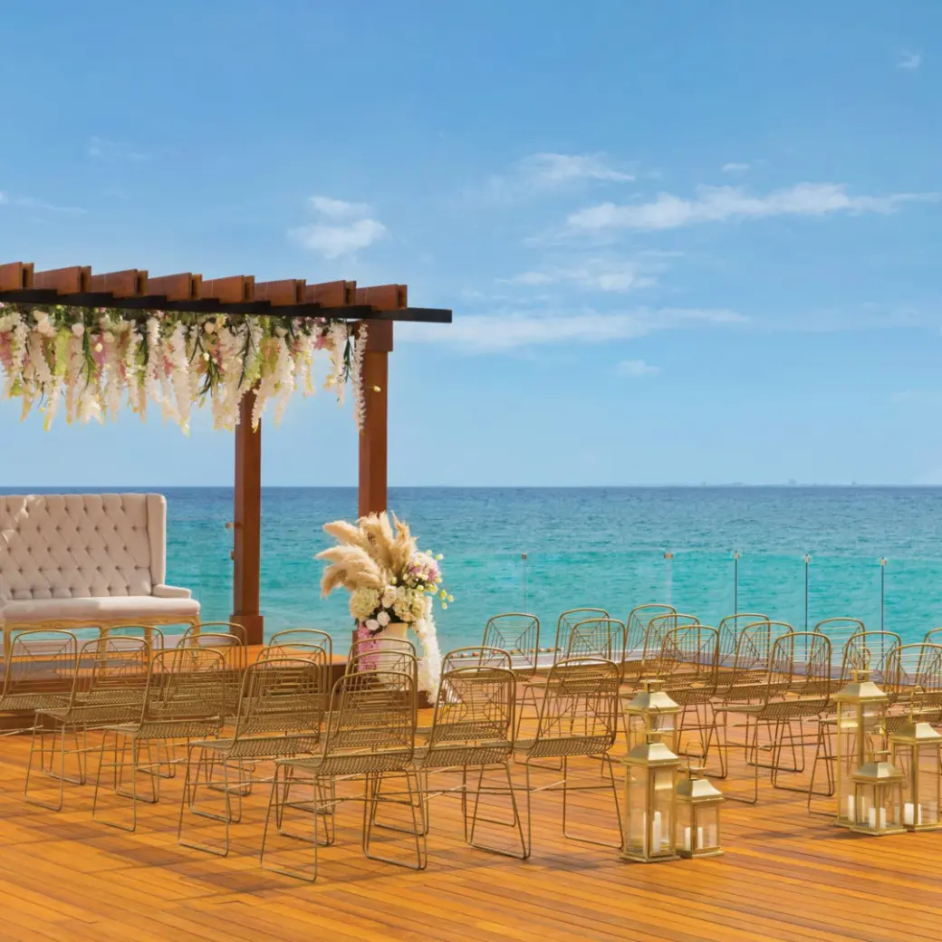 Oceanfront wedding ceremony setup on a terrace at Hilton Playa del Carmen