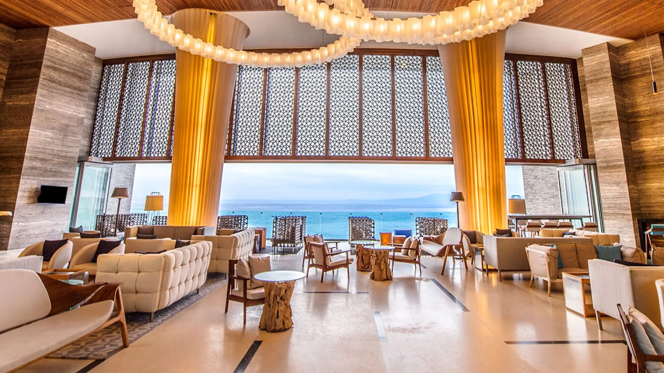 Hilton Vallarta Riviera open-air lobby with ocean views and modern seating, Puerto Vallarta