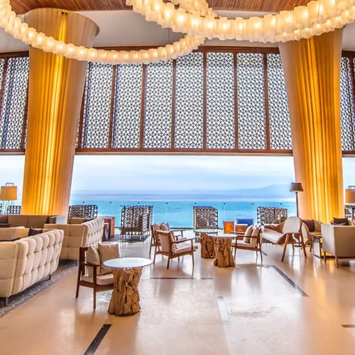 Hilton Vallarta Riviera open-air lobby with ocean views and modern seating, Puerto Vallarta