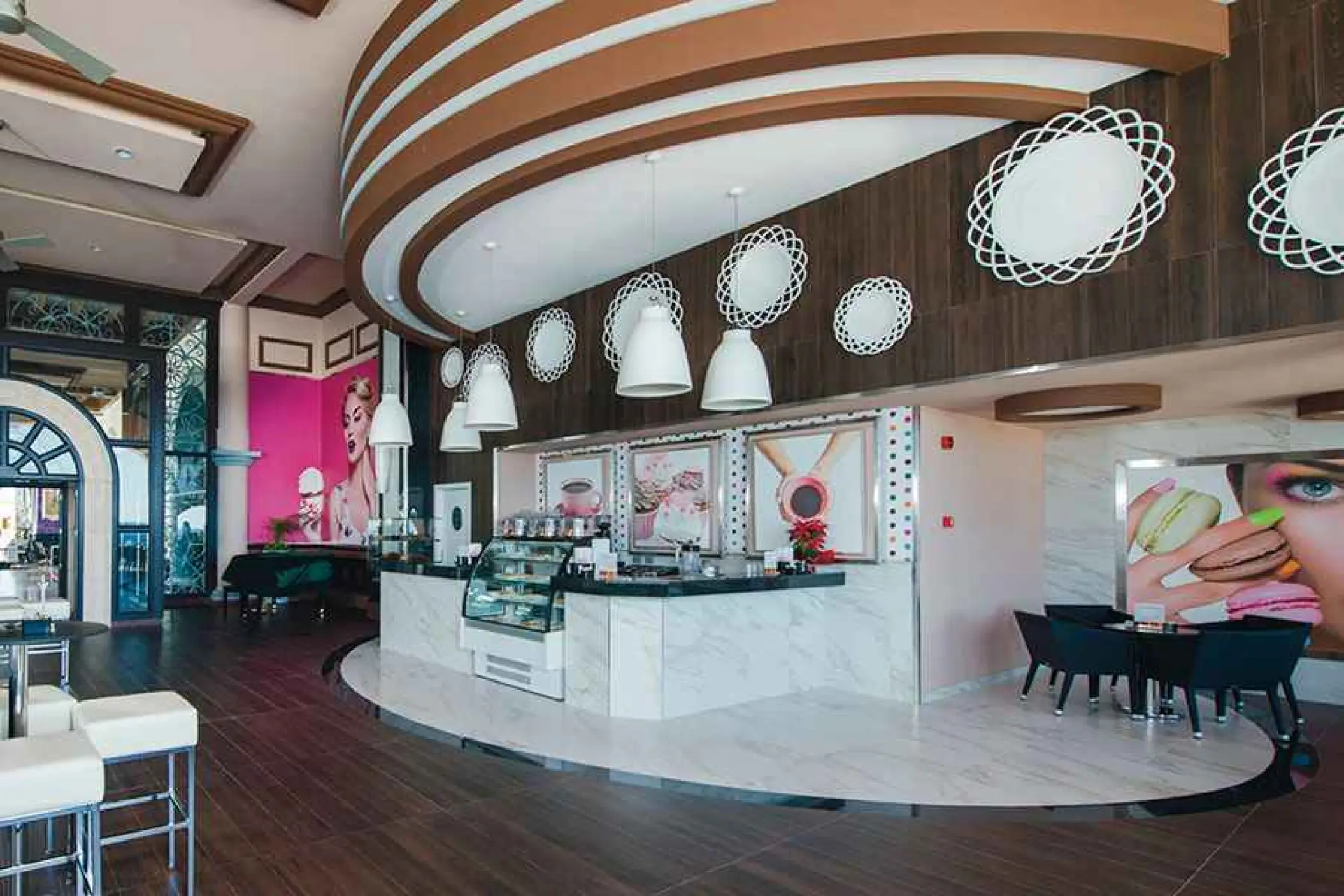 Modern pastry and coffee bar with white marble counters at Riu Palace Cabo San Lucas