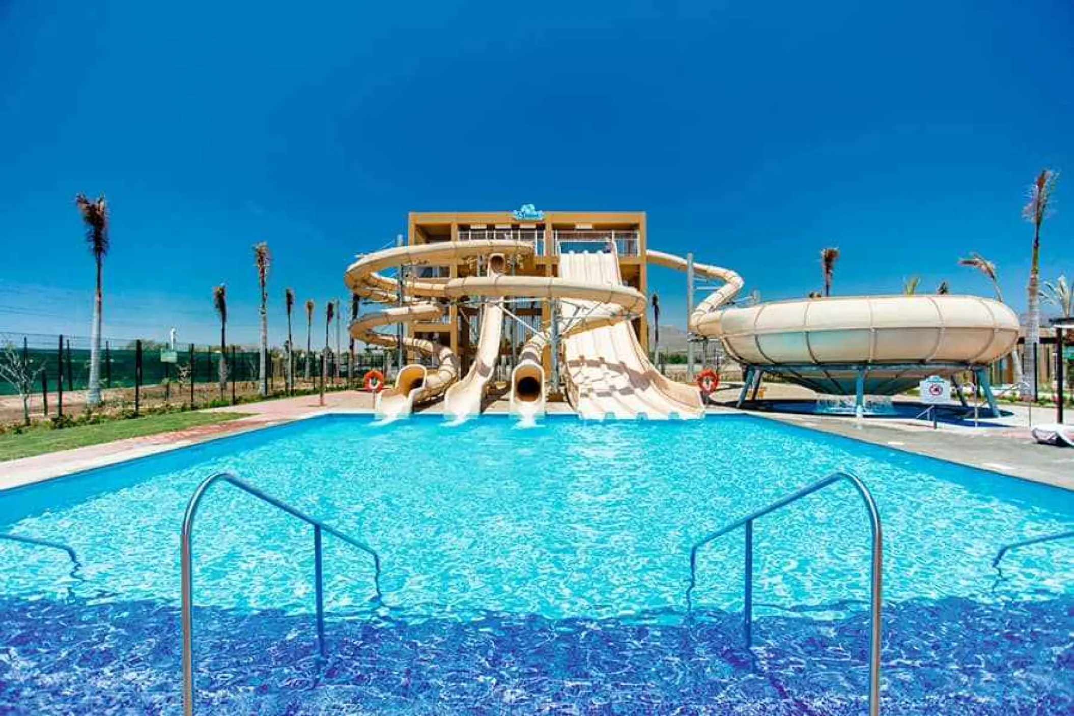 Outdoor water park with slides and splash pool at Riu Palace Cabo San Lucas