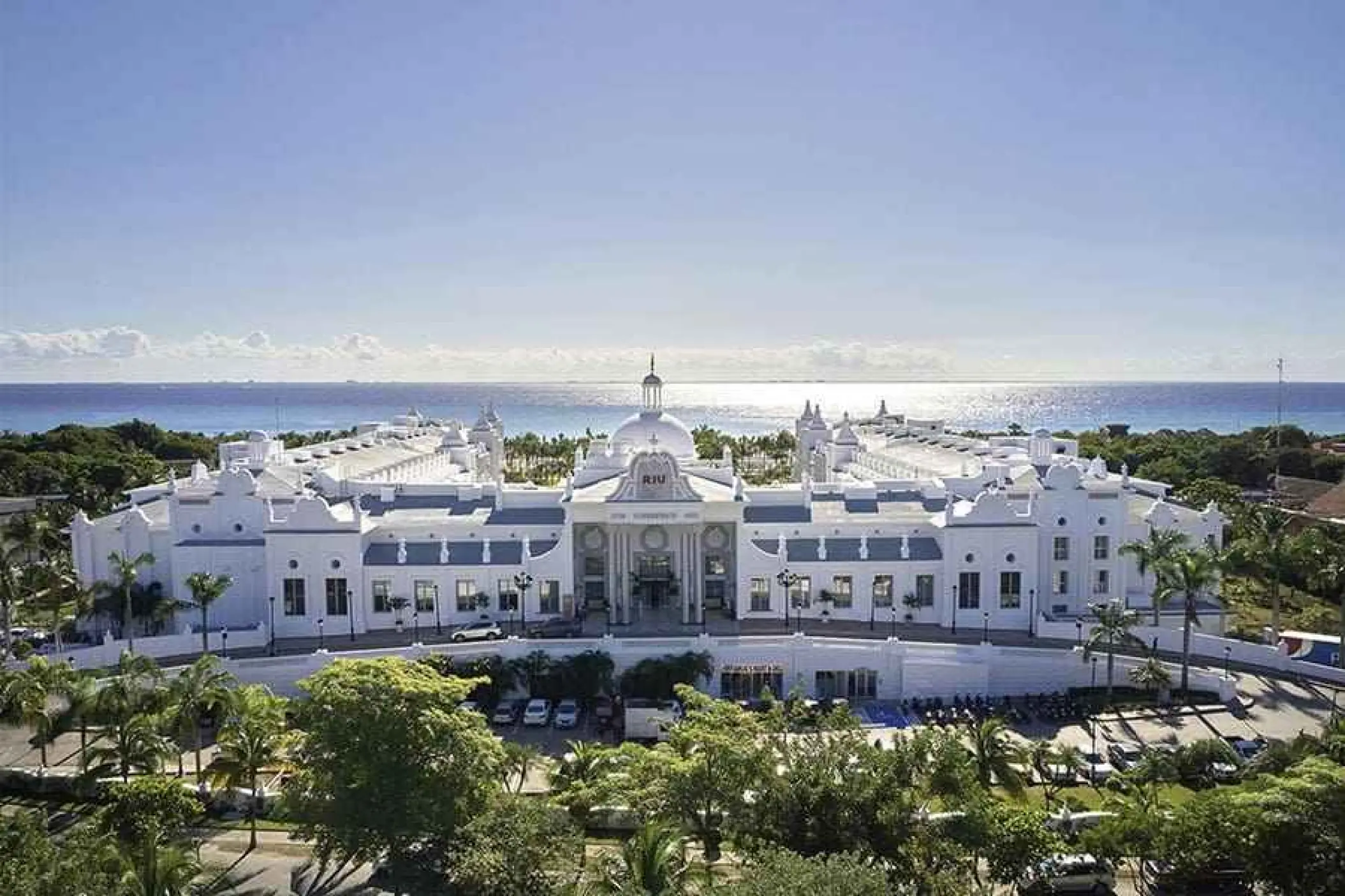 Aerial view of the white facade at Riu Palace Riviera Maya, Playa Del Carmen
