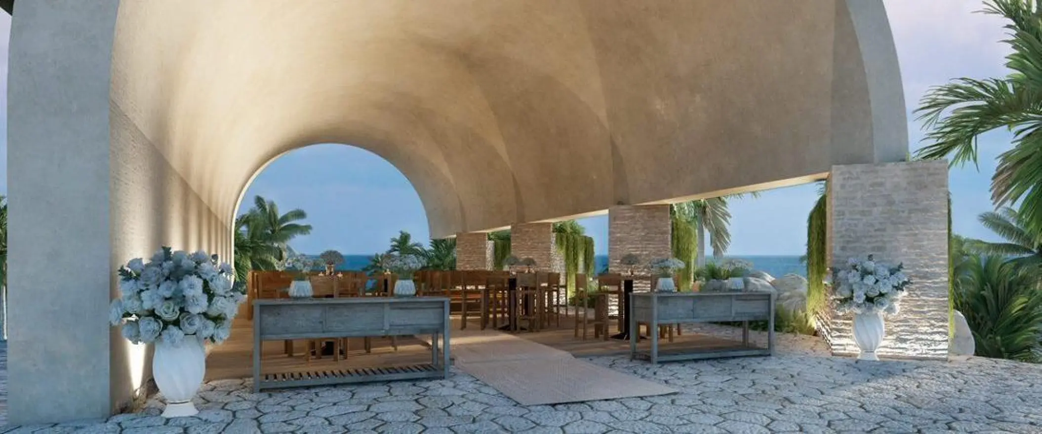 Ecumenical Temple wedding venue under a vaulted stone arch at Hotel Xcaret Arte, Riviera Maya