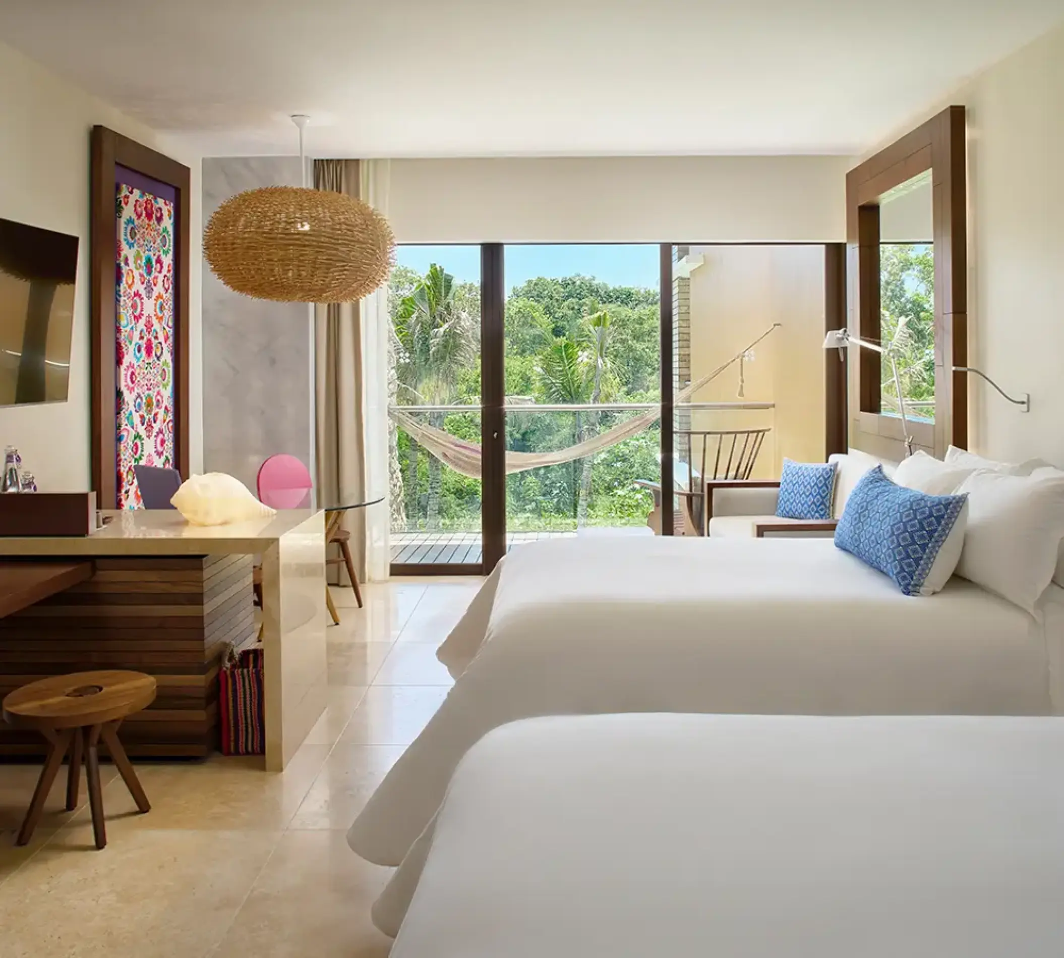 Garden suite with two beds and a private balcony at Hotel Xcaret Arte, Riviera Maya