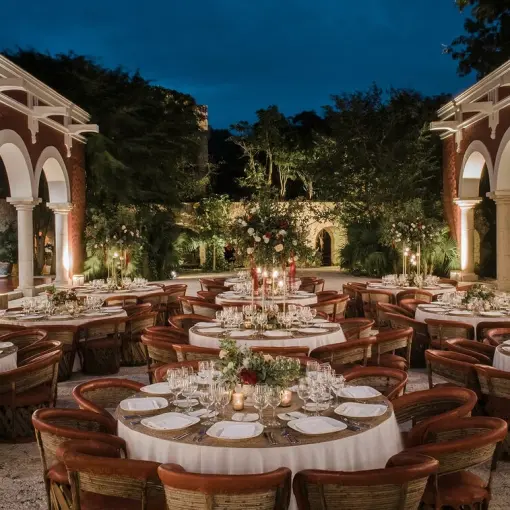 Evening wedding reception in the hacienda courtyard at Hotel Xcaret Arte, Riviera Maya