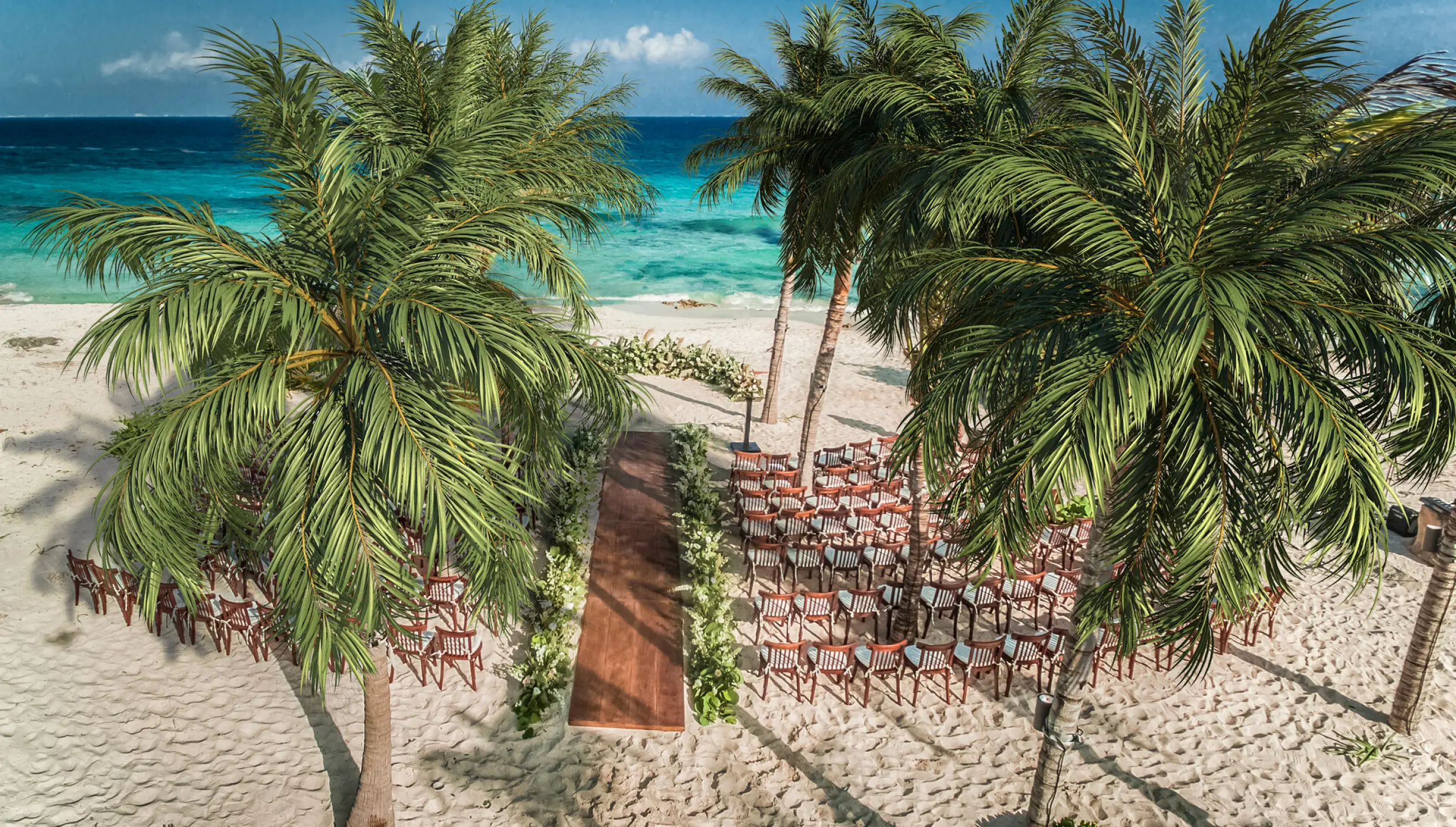 beach wedding venue with chairs at Hotel Xcaret Mexico