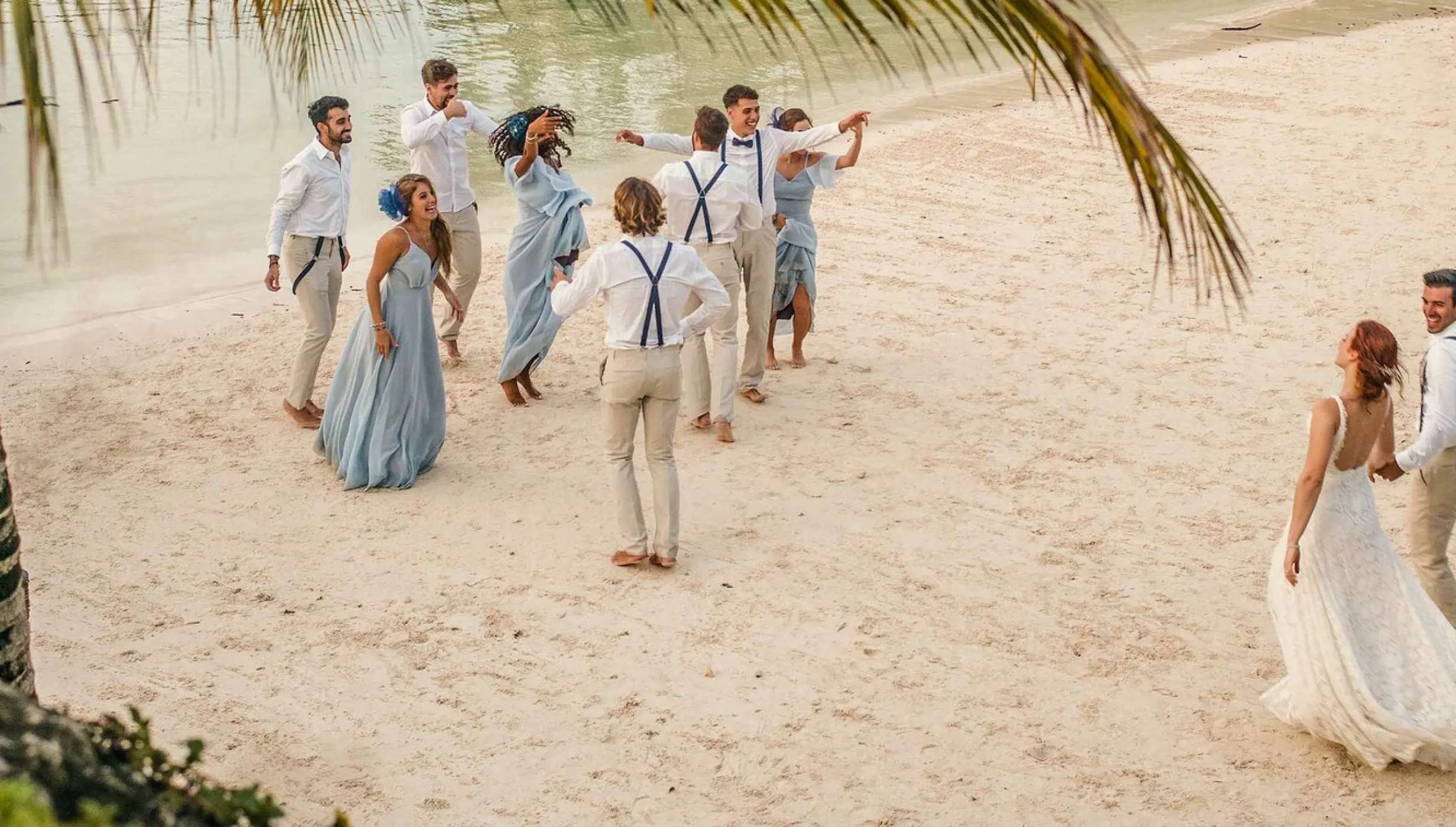 Hotel Xcaret wedding beach party with guests and couples dancing