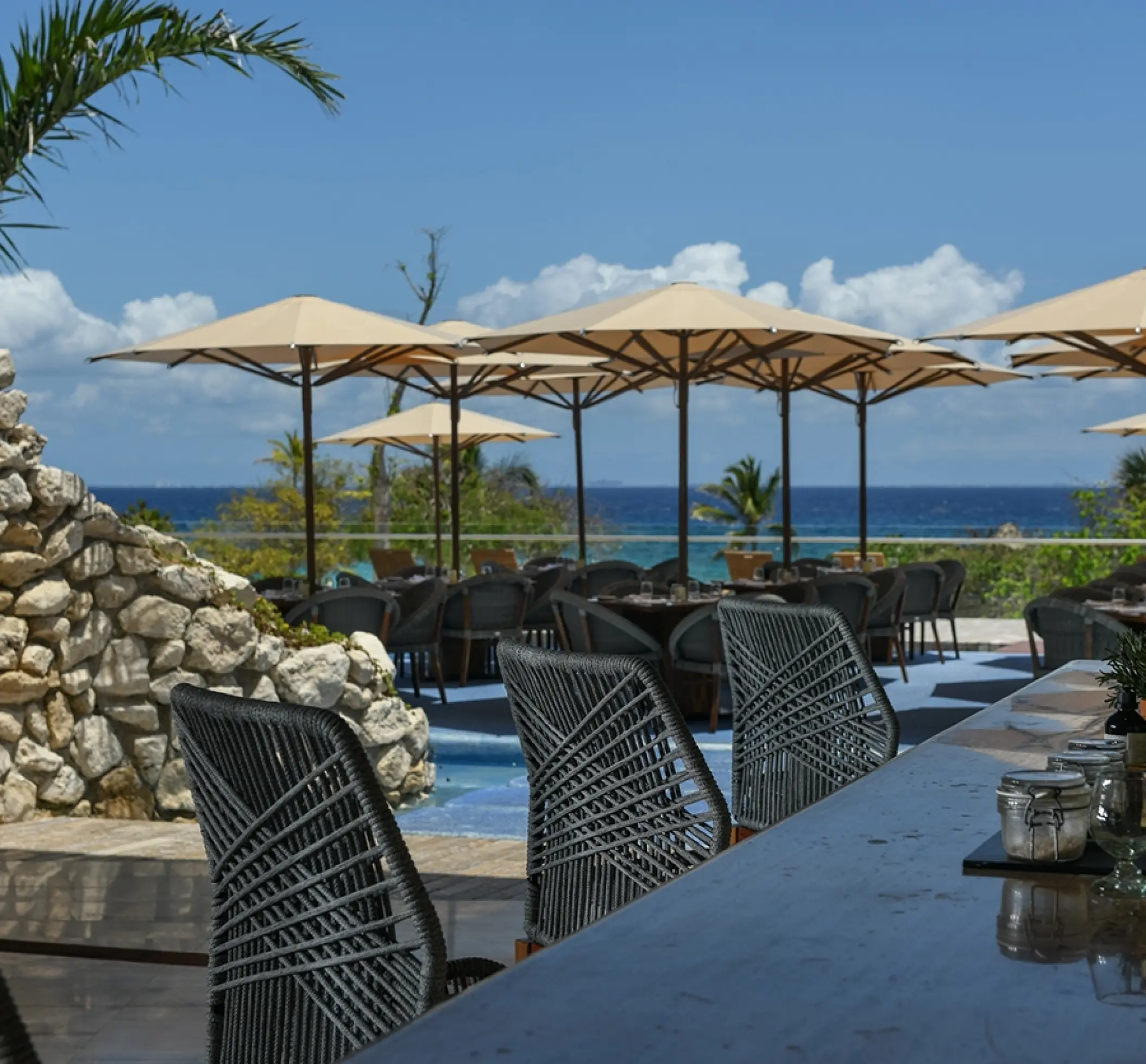 Outdoor terrace restaurant with ocean views at Hotel Xcaret Arte, Riviera Maya