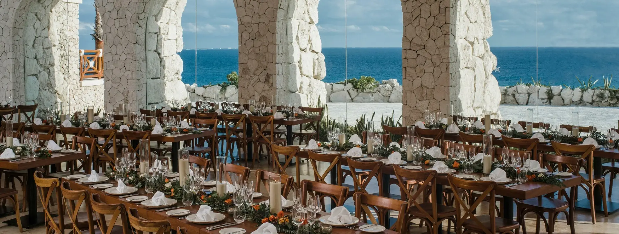 Xpiral ballroom wedding reception with stone arches at Hotel Xcaret Mexico, Riviera Maya