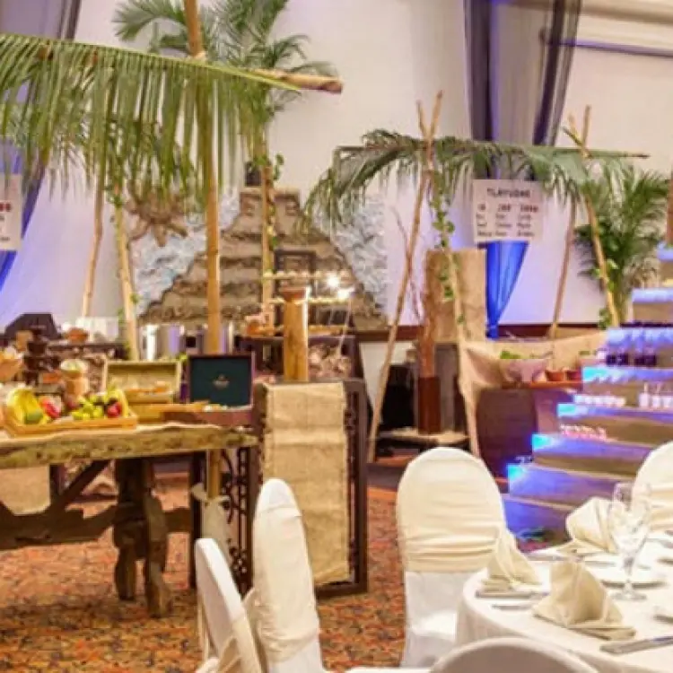 Indoor wedding reception with a tropical food display at Hyatt Zilara Cancun