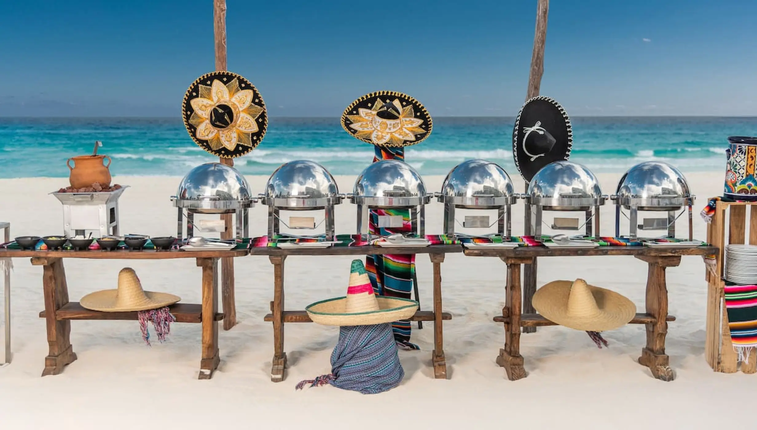 Mexican buffet station on the beach with sombreros at Hyatt Zilara Cancun