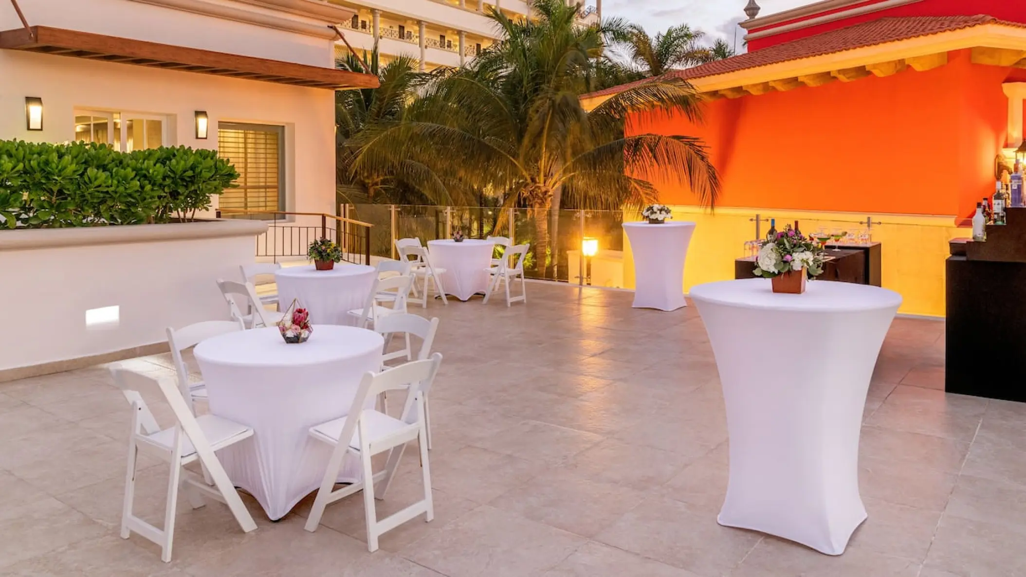 Cocktail tables and chairs set up for a wedding reception at Hyatt Zilara Cancun