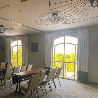 Indoor ballroom with rows of chairs and modern light fixtures at Hyatt Zilara Riviera Maya, Riviera Maya
