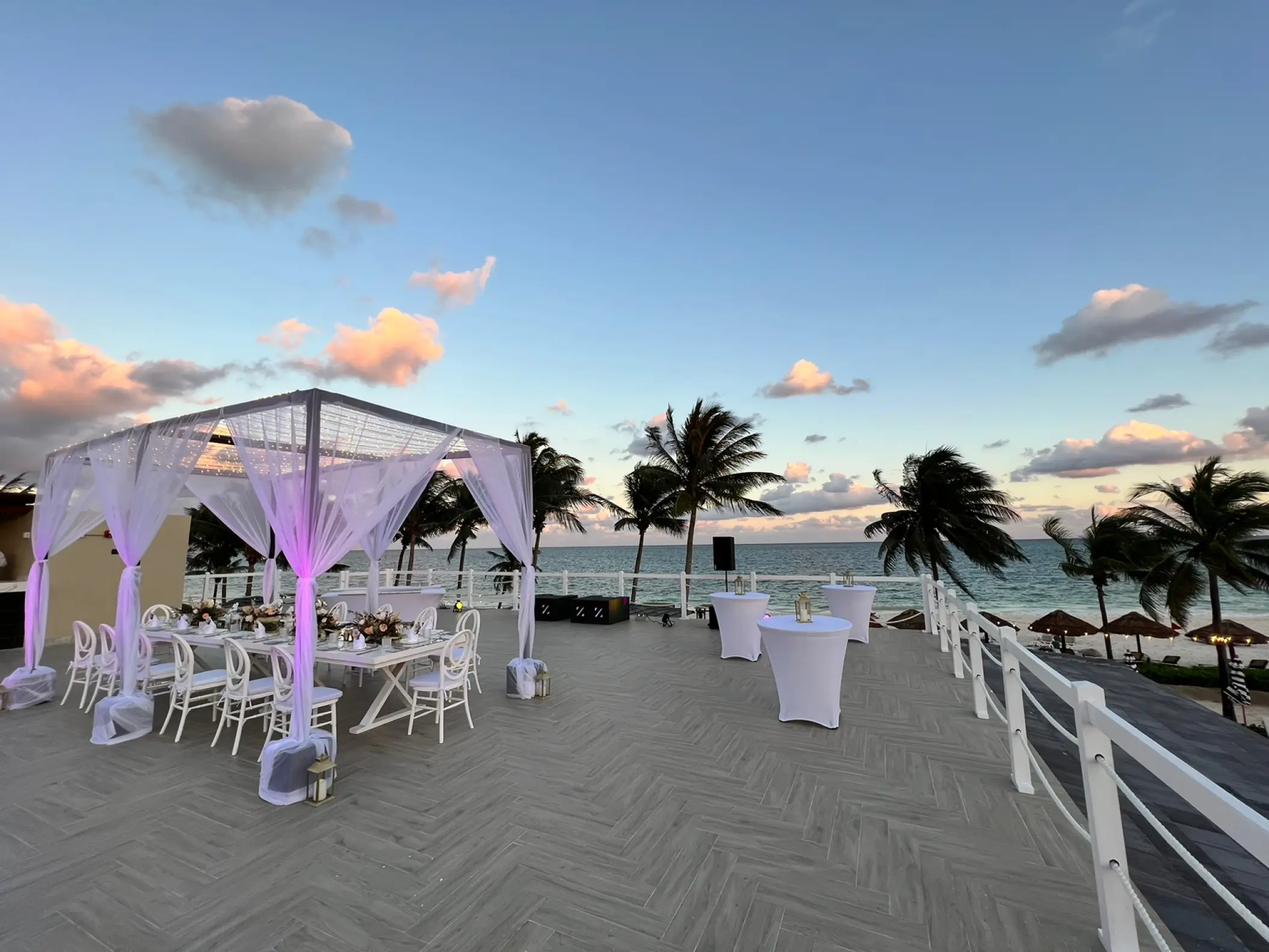 Rooftop wedding reception with a white canopy and dining table at Hyatt Zilara Riviera Maya