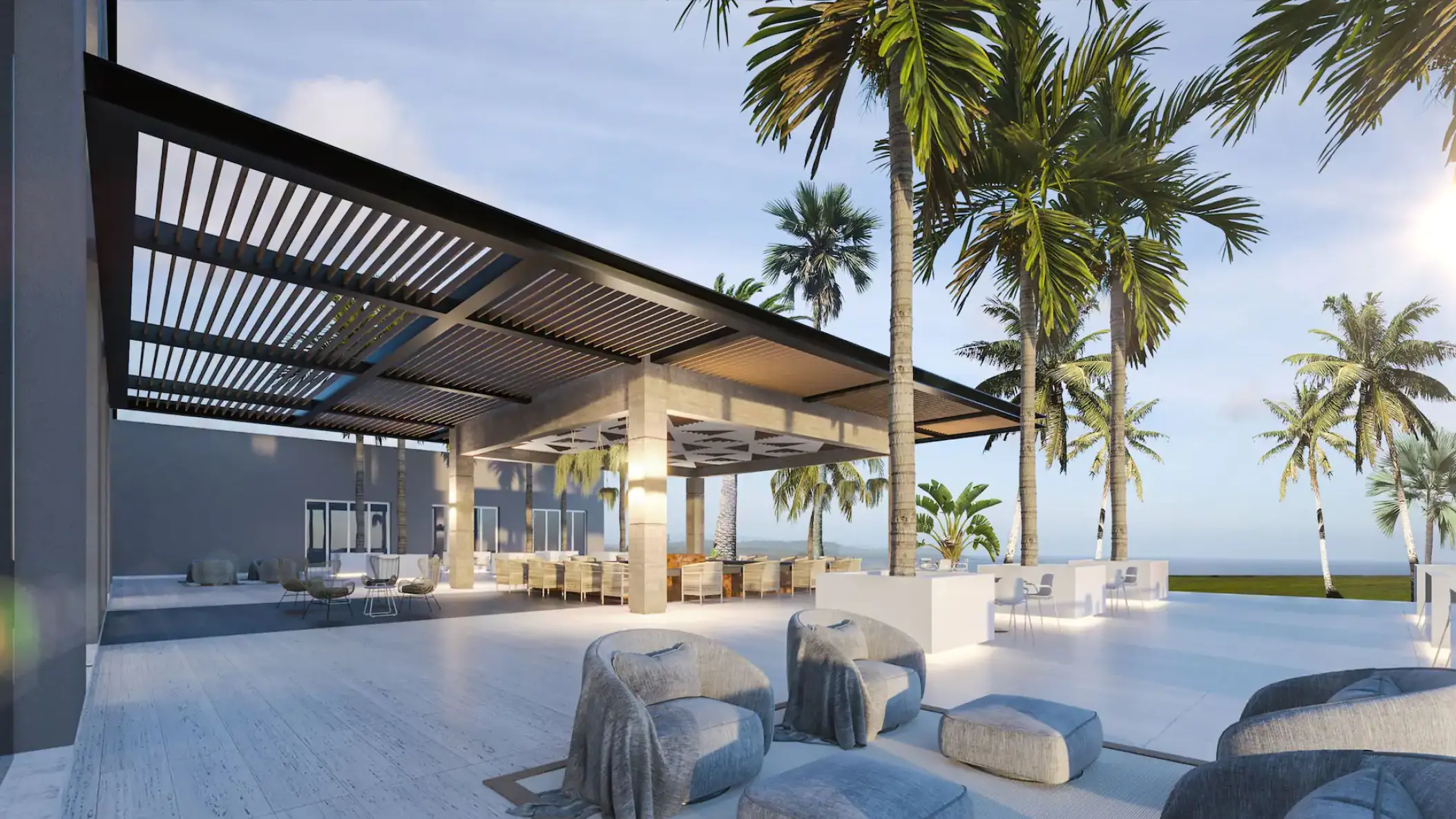 Breeze outdoor terrace at Hyatt Ziva Cancun with modern seating and palm trees overlooking the ocean
