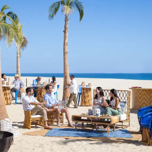 Beach cocktail hour with lounge seating and bar at Hyatt Ziva Los Cabos, Cabo San Lucas