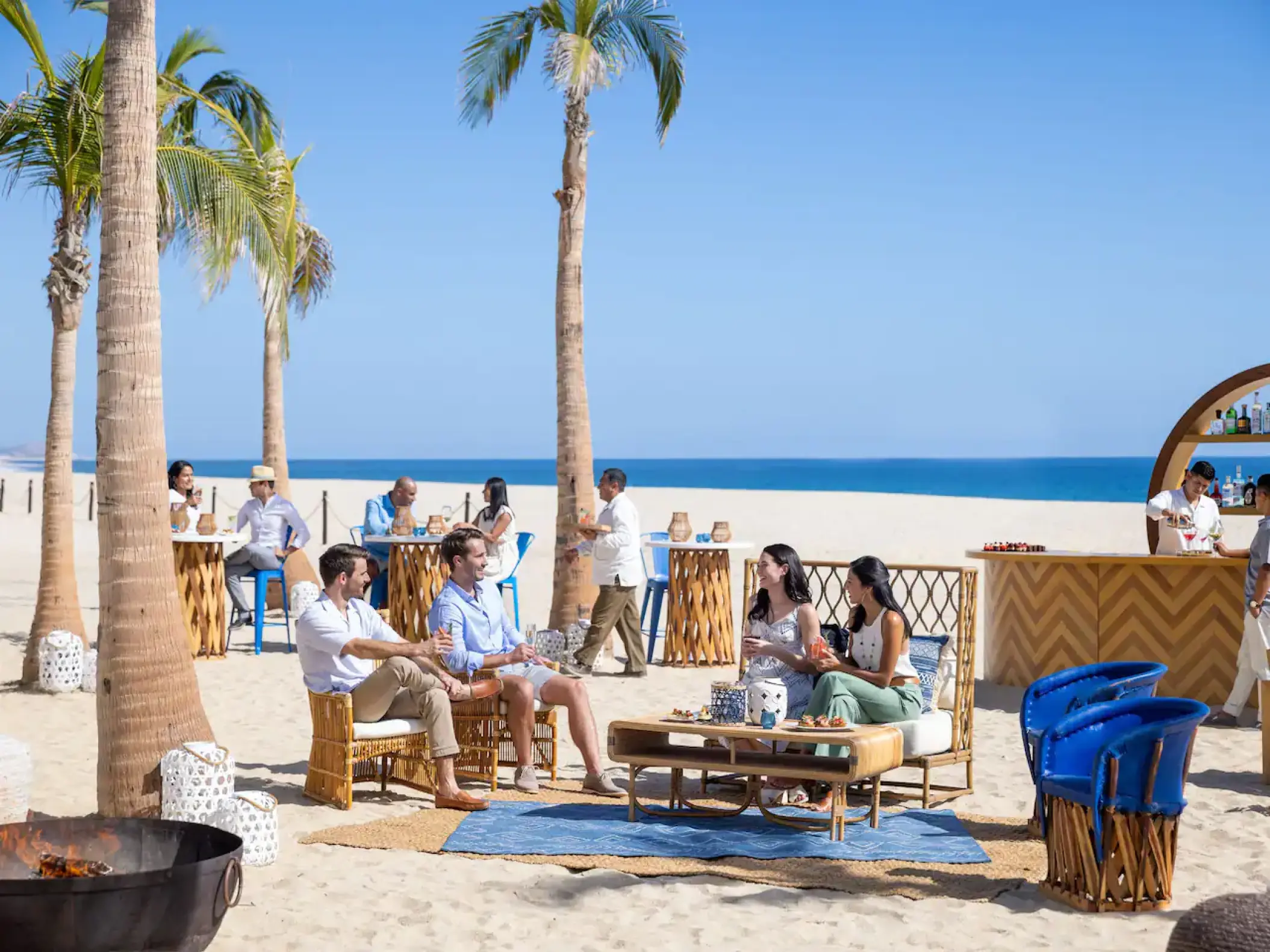 Beach cocktail hour with lounge seating and bar at Hyatt Ziva Los Cabos, Cabo San Lucas