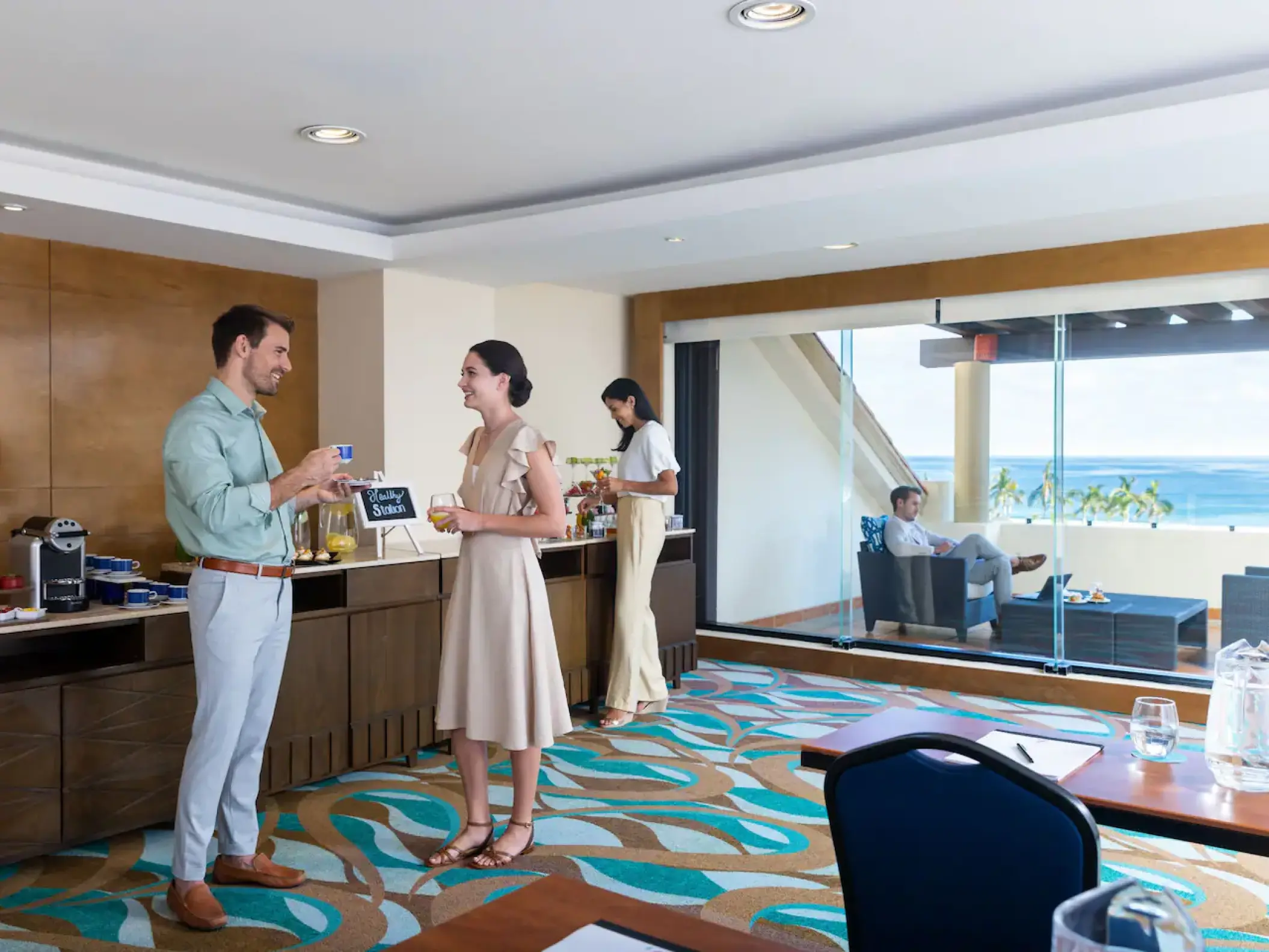 Guests in a Hyatt Ziva Los Cabos breakout room with ocean views, Cabo San Lucas