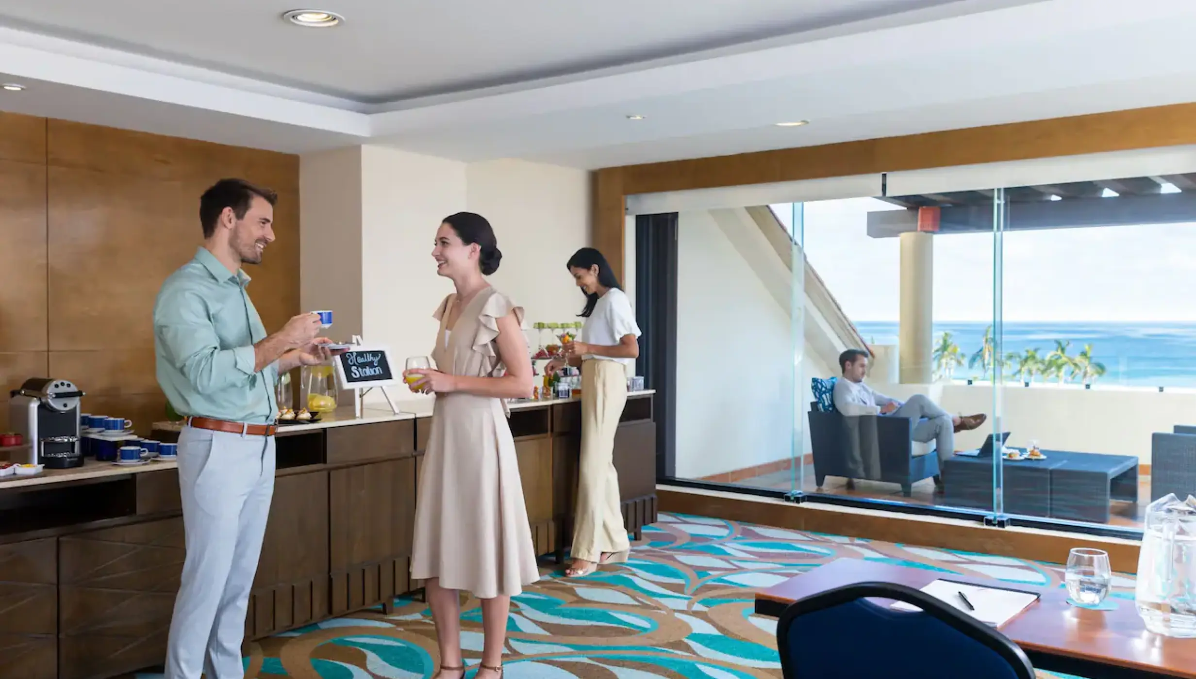 Guests in a Hyatt Ziva Los Cabos breakout room with ocean views, Cabo San Lucas