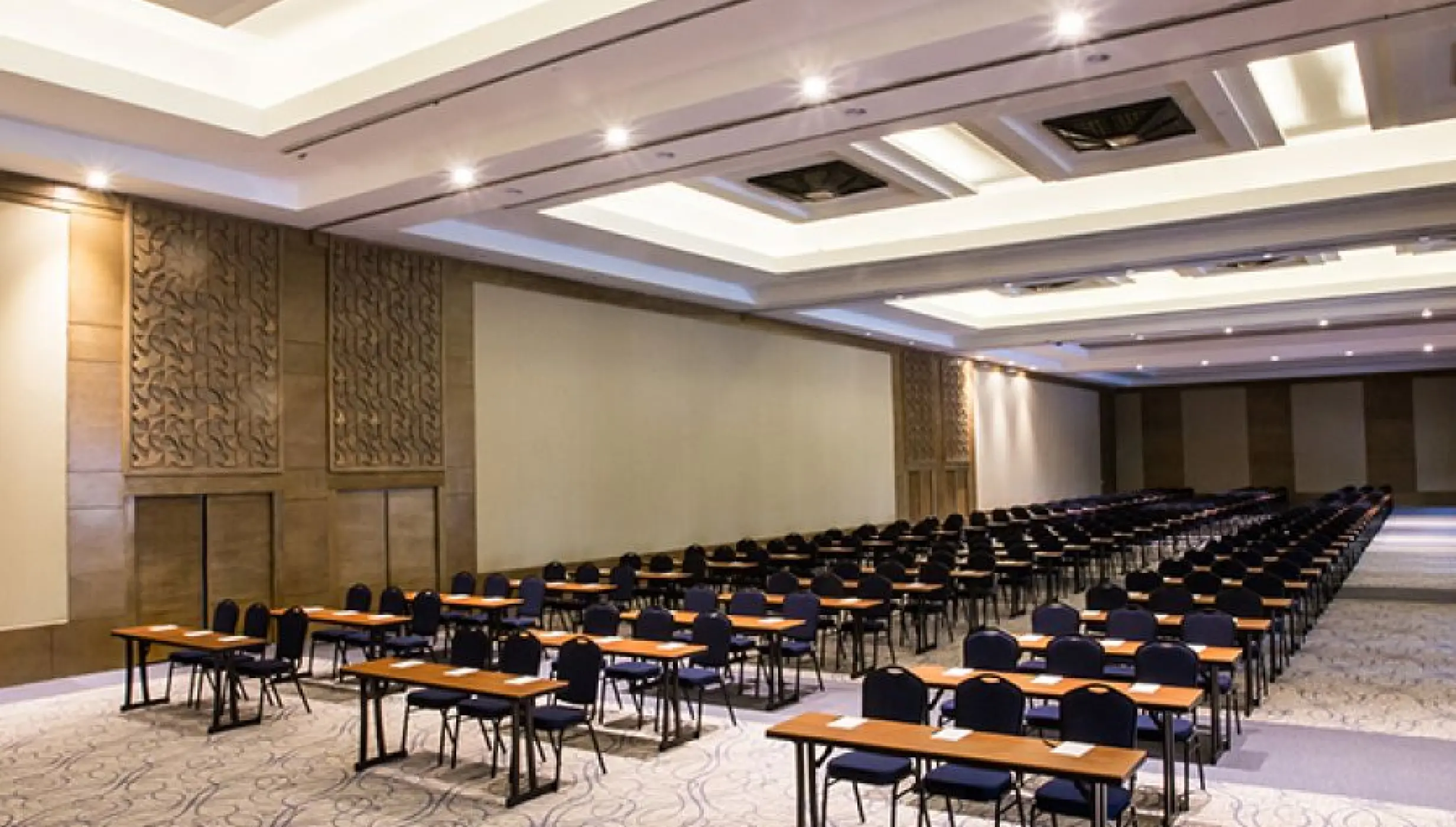 Indoor convention center with rows of tables and chairs at Hyatt Ziva Los Cabos, Cabo San Lucas