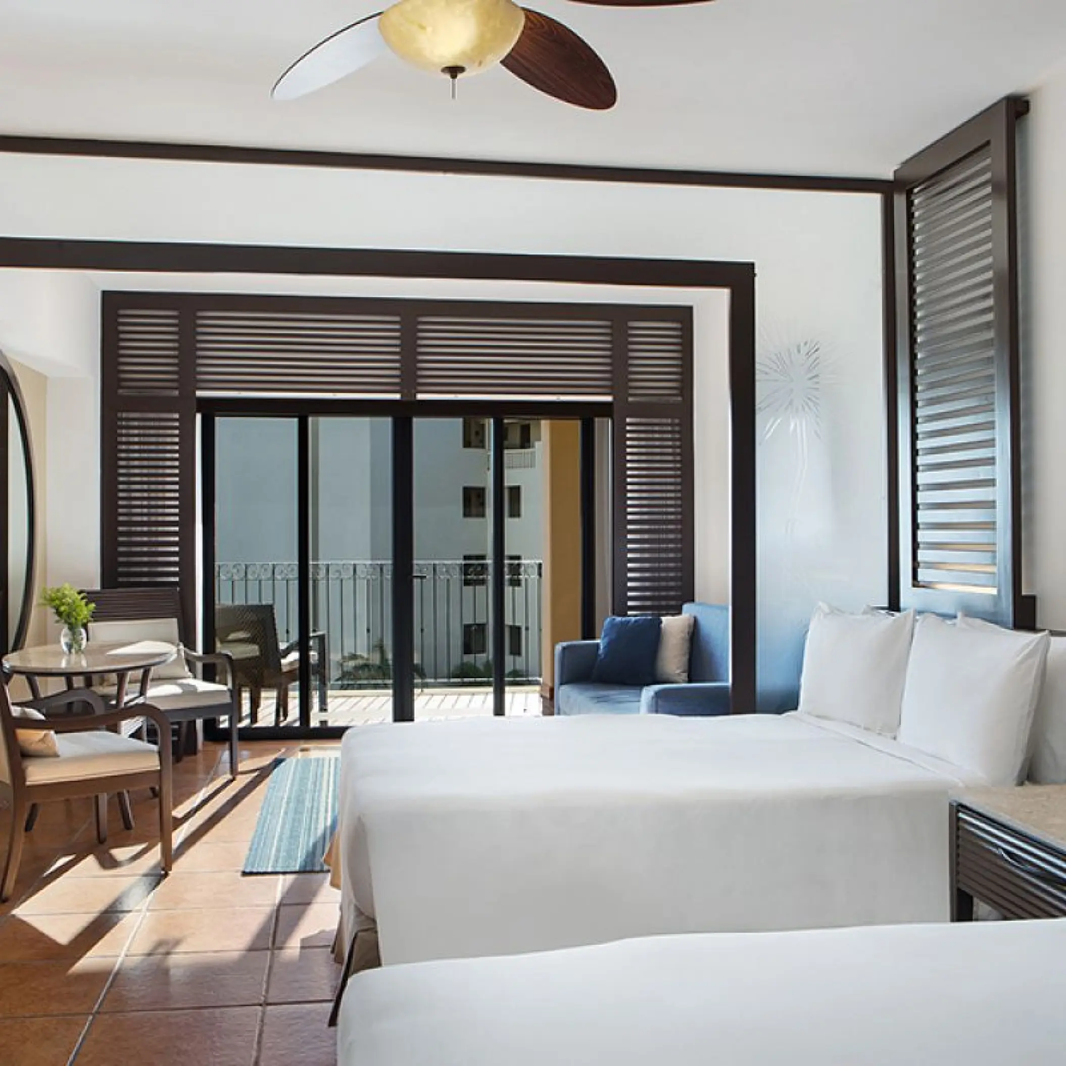 Modern suite with two beds and a private balcony at Hyatt Ziva Los Cabos, Cabo San Lucas