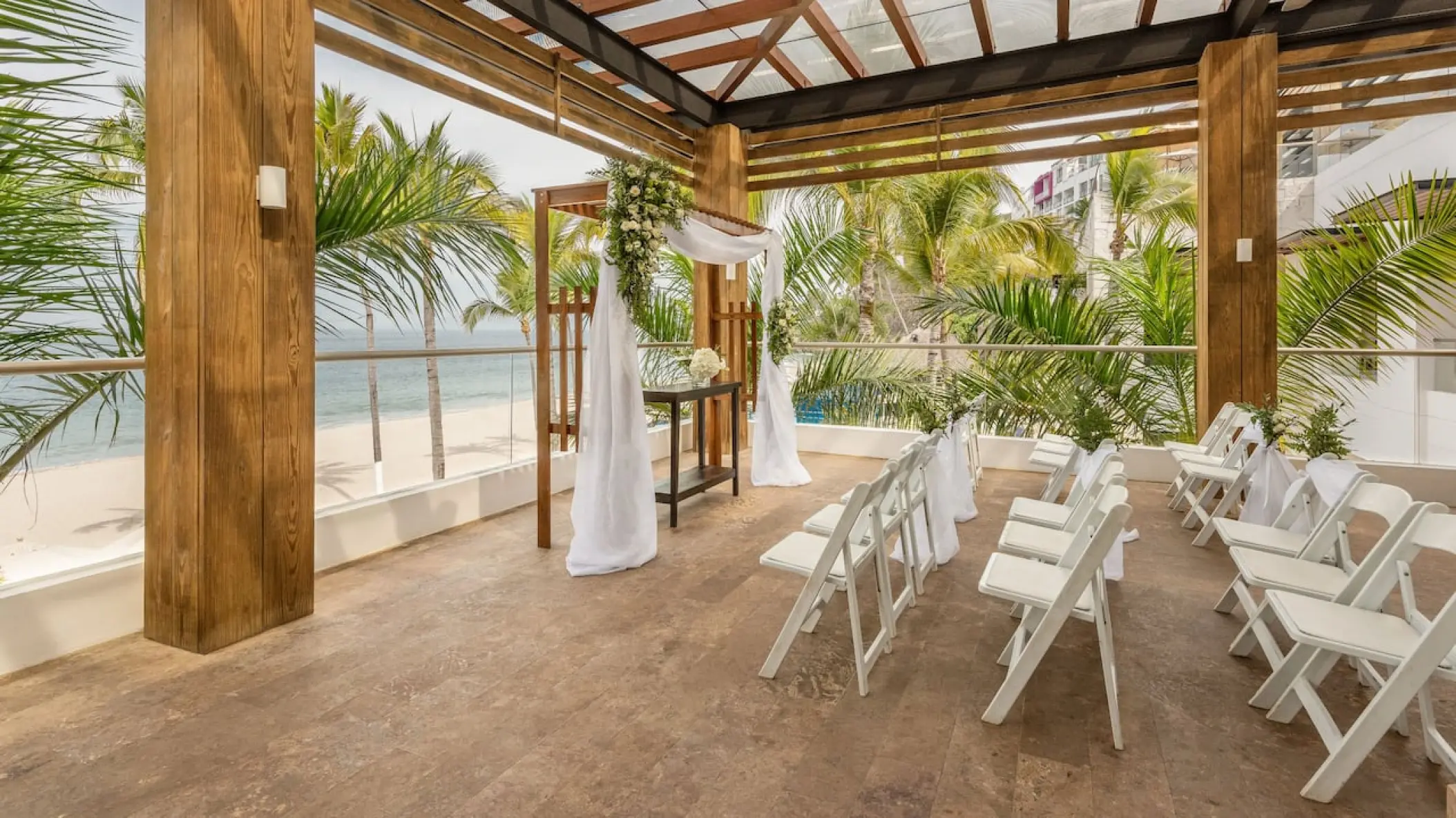 Sports bar terrace wedding ceremony setup with ocean views at Hyatt Ziva Puerto Vallarta